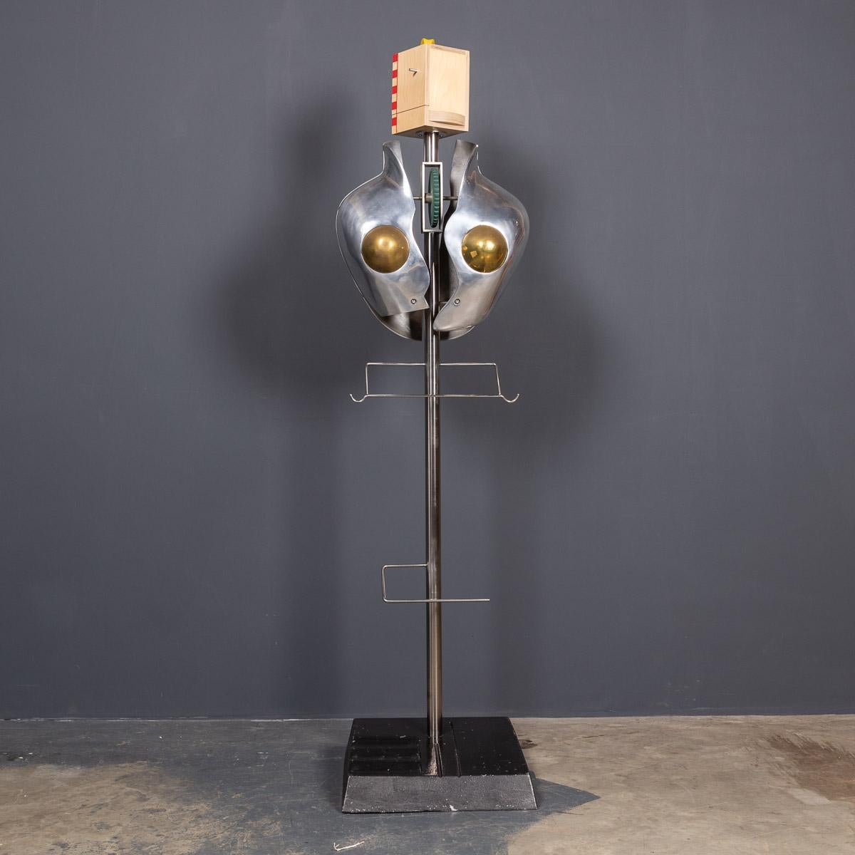 This quirky valet is from the iconic 80's, it has a polished metal torso with brass details, the style echos of a 