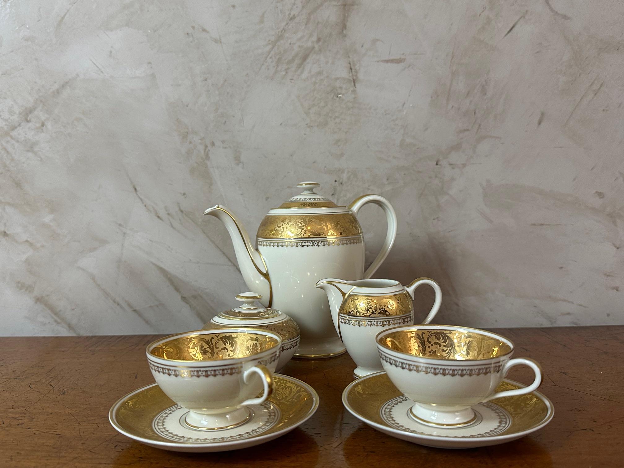 Very nice 20th century porcelain coffee set signed Thomas Bavaria from Germany, signed under each piece. Beautiful white and gold porcelain. 
Two coffee cups with saucers, tea-pot, milk pot and sugar pot. 
Perfect condition. 