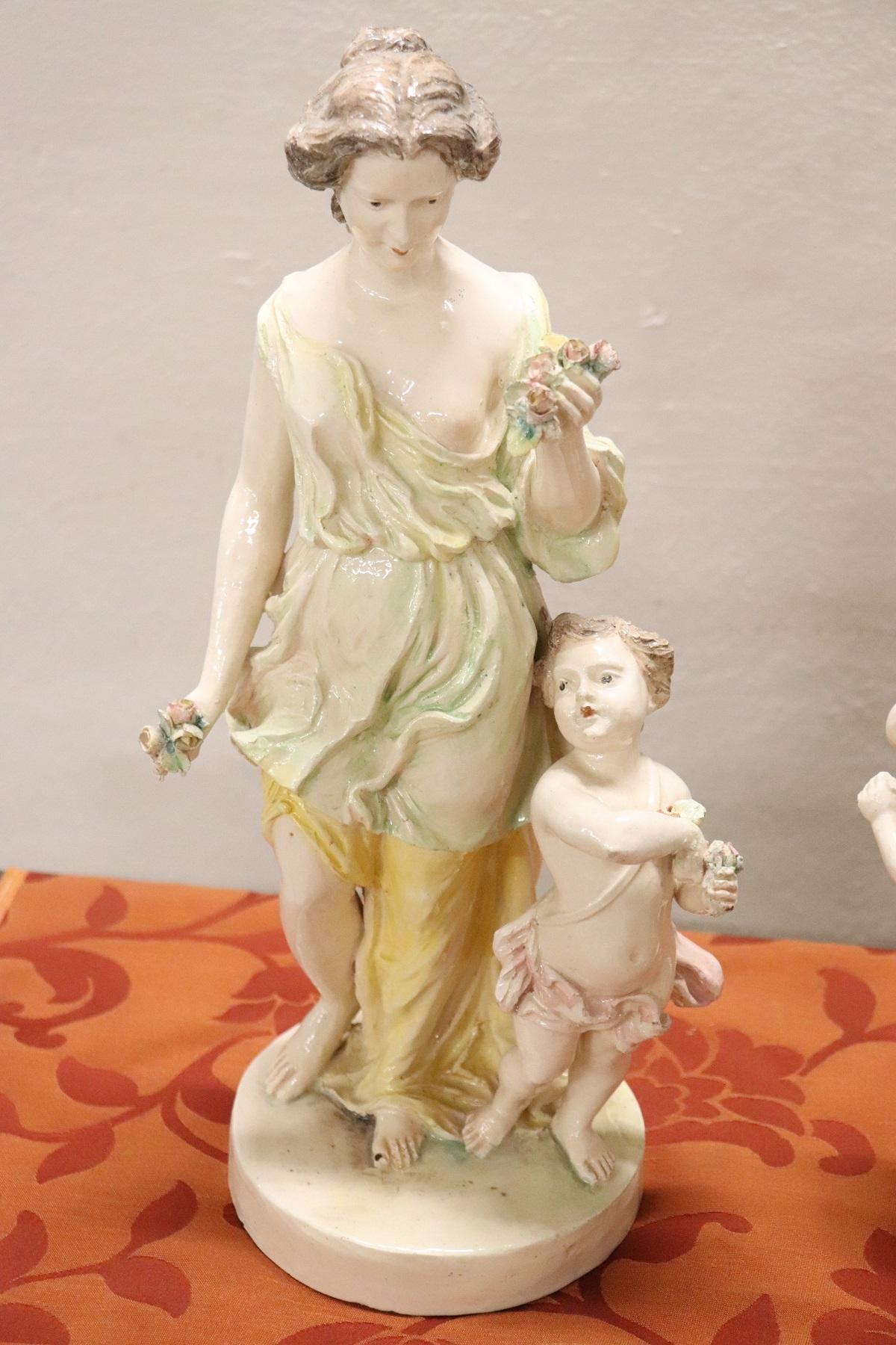 Group of 4 hand painted porcelain sculptures. Famous Italian brand at the Capodimonte base. The four girls represent the Four Seasons.
