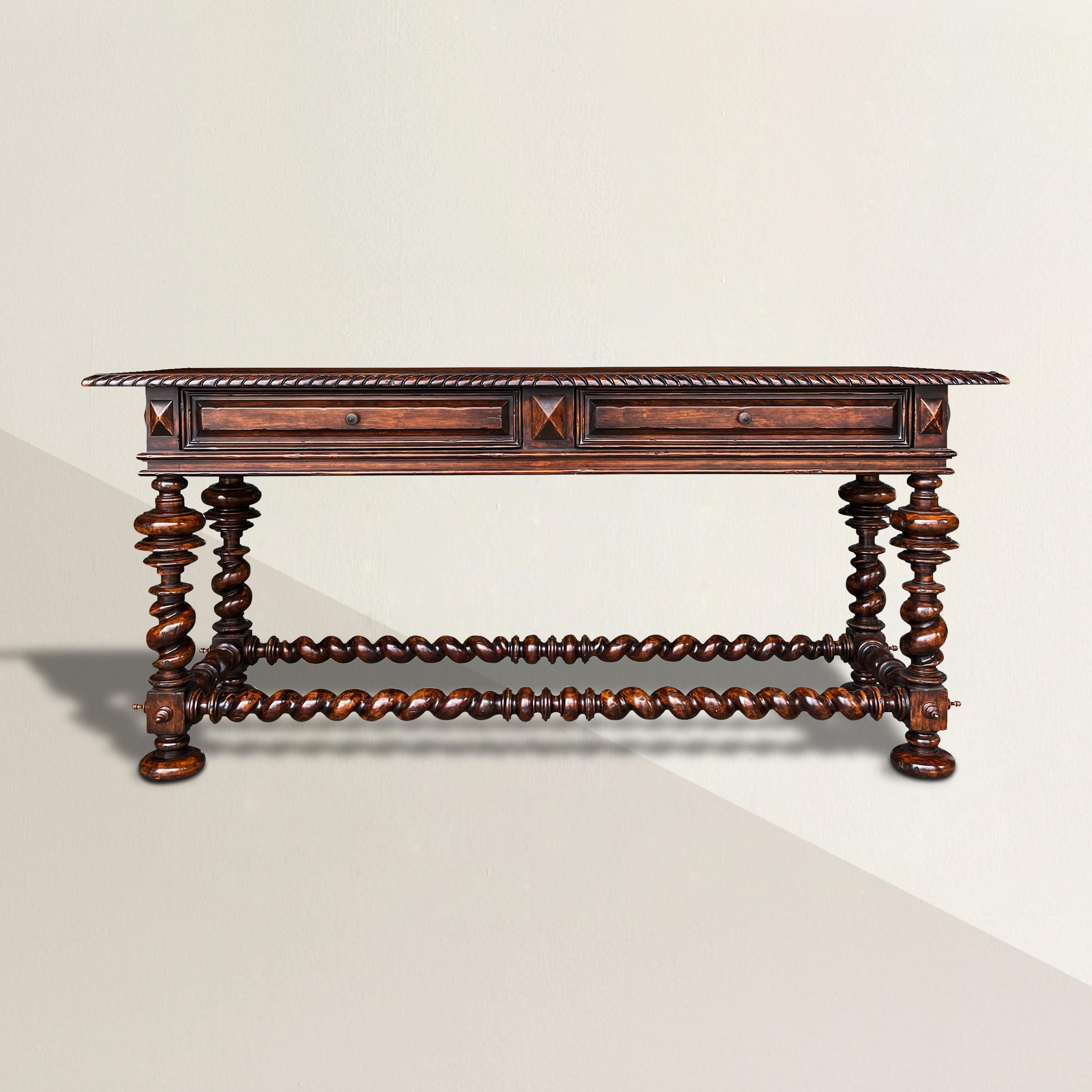 A bold and striking 20th century Portuguese-style console table with wonderfully elaborate turned legs with barley twist spandrels and large bun feet, and two drawers with bronze knobs. Perfect in your entry, behind a sofa, or under your television