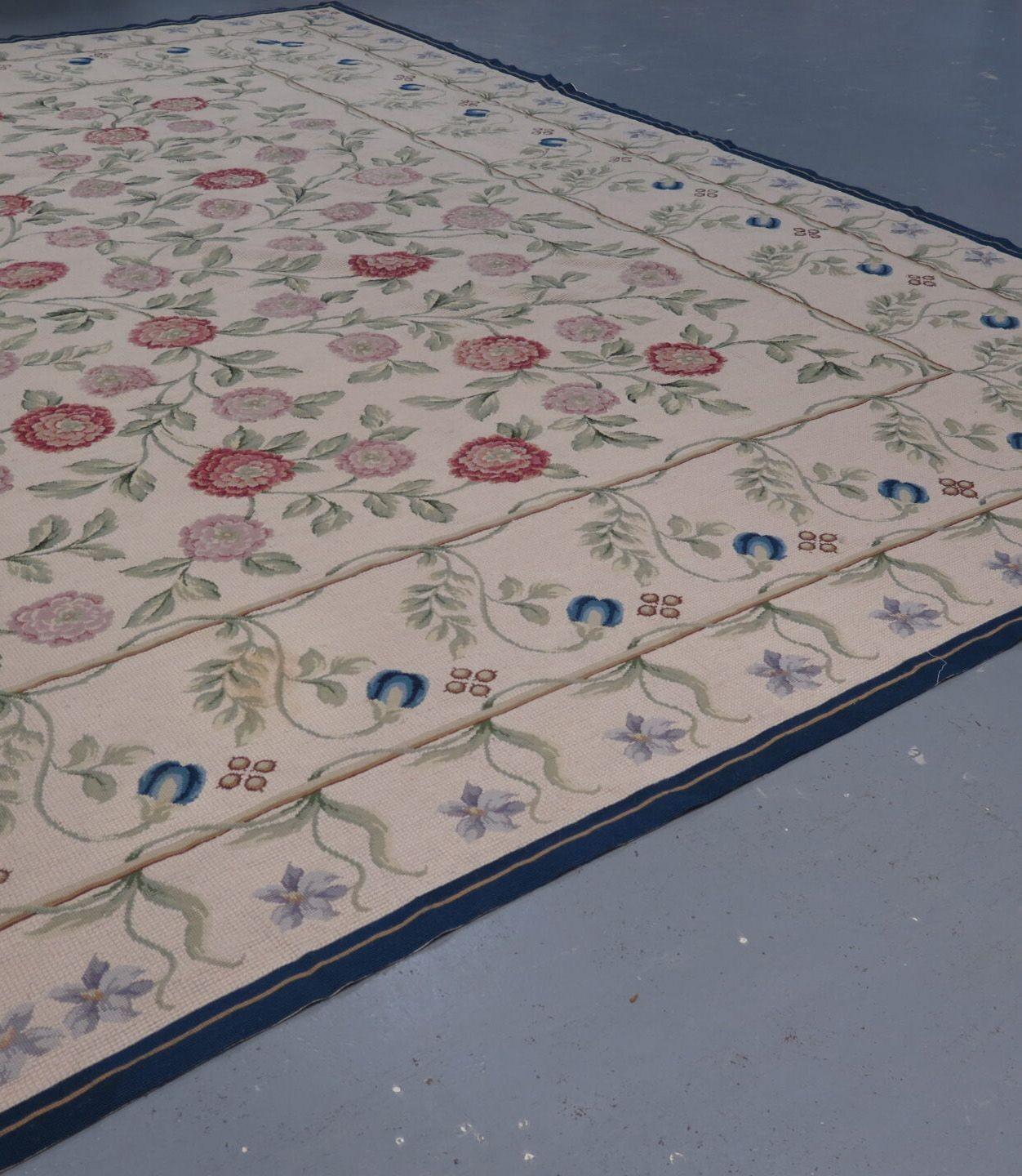 Among Portugal's textiles, perhaps none are as widely sought after as its needlepoint rugs - termed Arraiolos carpets - such as this vintage example. Finely handwoven some time in the last 30 years.
It features a series of scrolling floral and