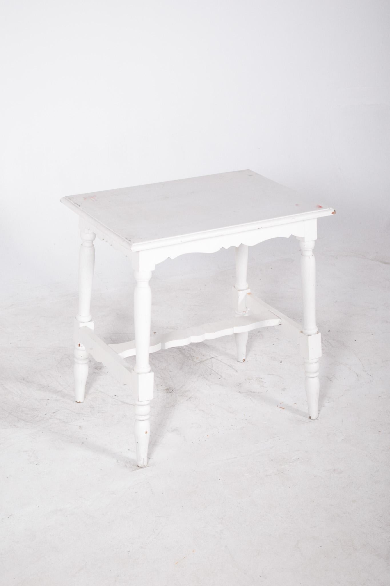 White painted coffee table. A classic design with romantic inspiration and rustic touches, the white painted wooden structure reveals discreet marks of time, giving it a vintage and cosy appeal. The turned legs reinforce the traditional style, while