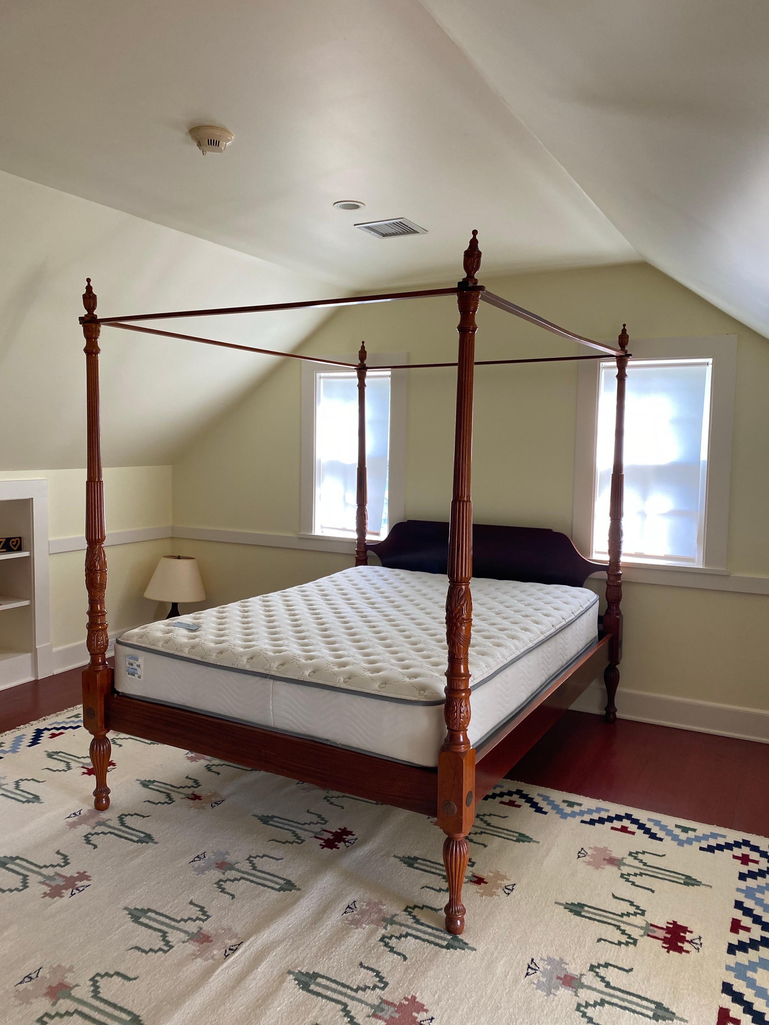 20th Century Queen Size Four Poster Canopy Bed with Rails
This elegant four-poster bed features intricately carved posts of a very nice reproduction of the early Victorian style poster bed. The detailed carvings display a wheat sheaf and bow motif.