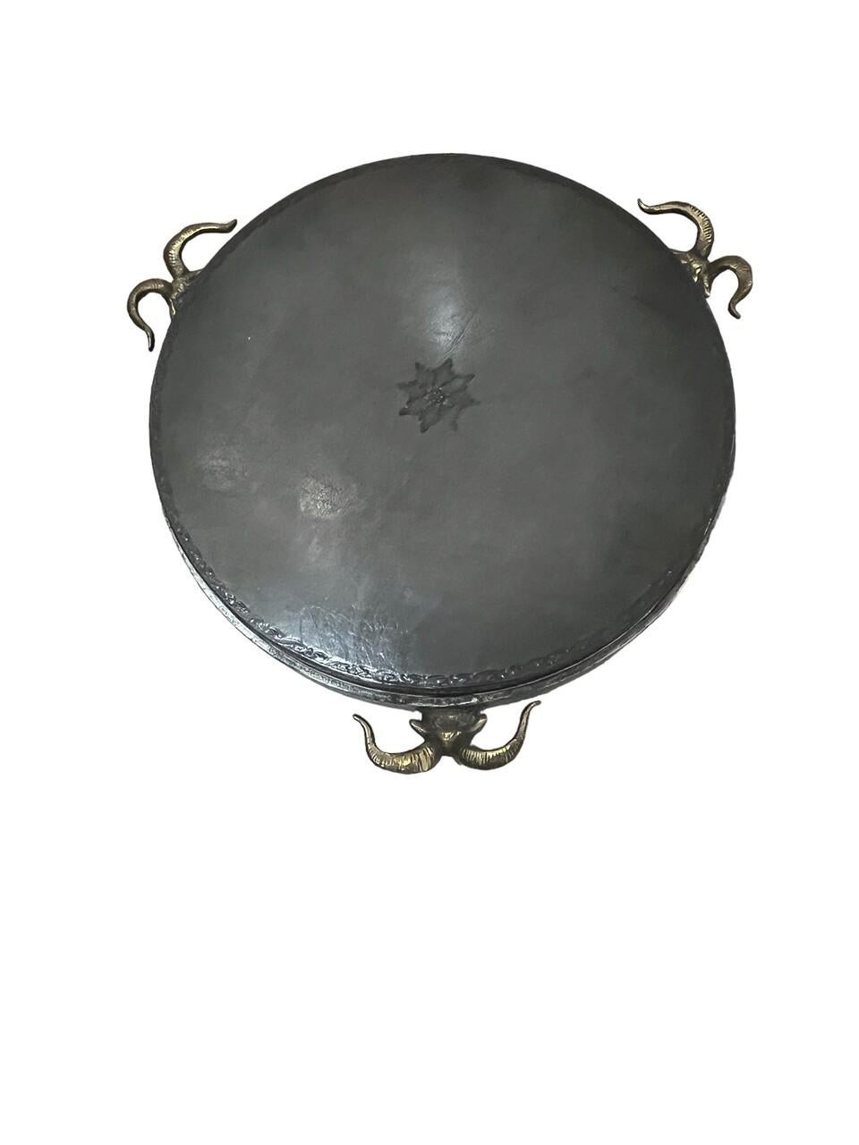 20th Century Rams Head Side Table. Bronze Rams heads and feet. Has embossed leather top that has been lacquered and matching hoof feet,
