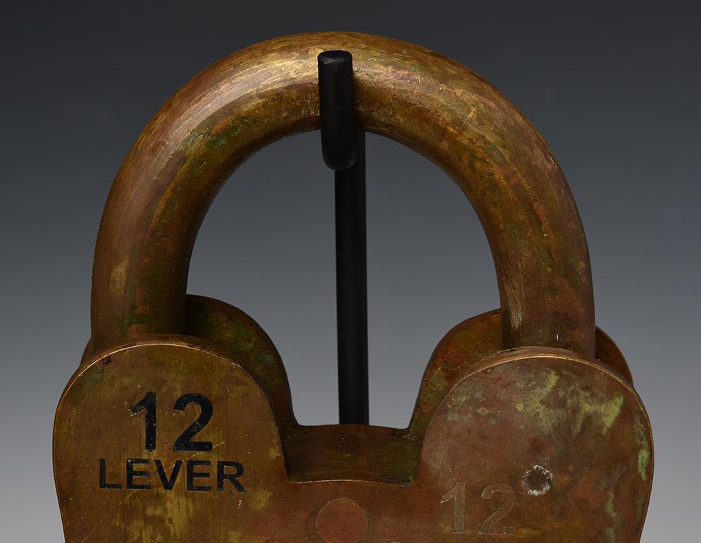 Rare and large British bronze lock.

Age: England, 20th Century
Size: Height 30.3 C.M. / Width 17.8 C.M. / Thickness 6.5 C.M. (size excluding stand)
Condition: Nice condition overall.

100% satisfaction and authenticity guaranteed with free