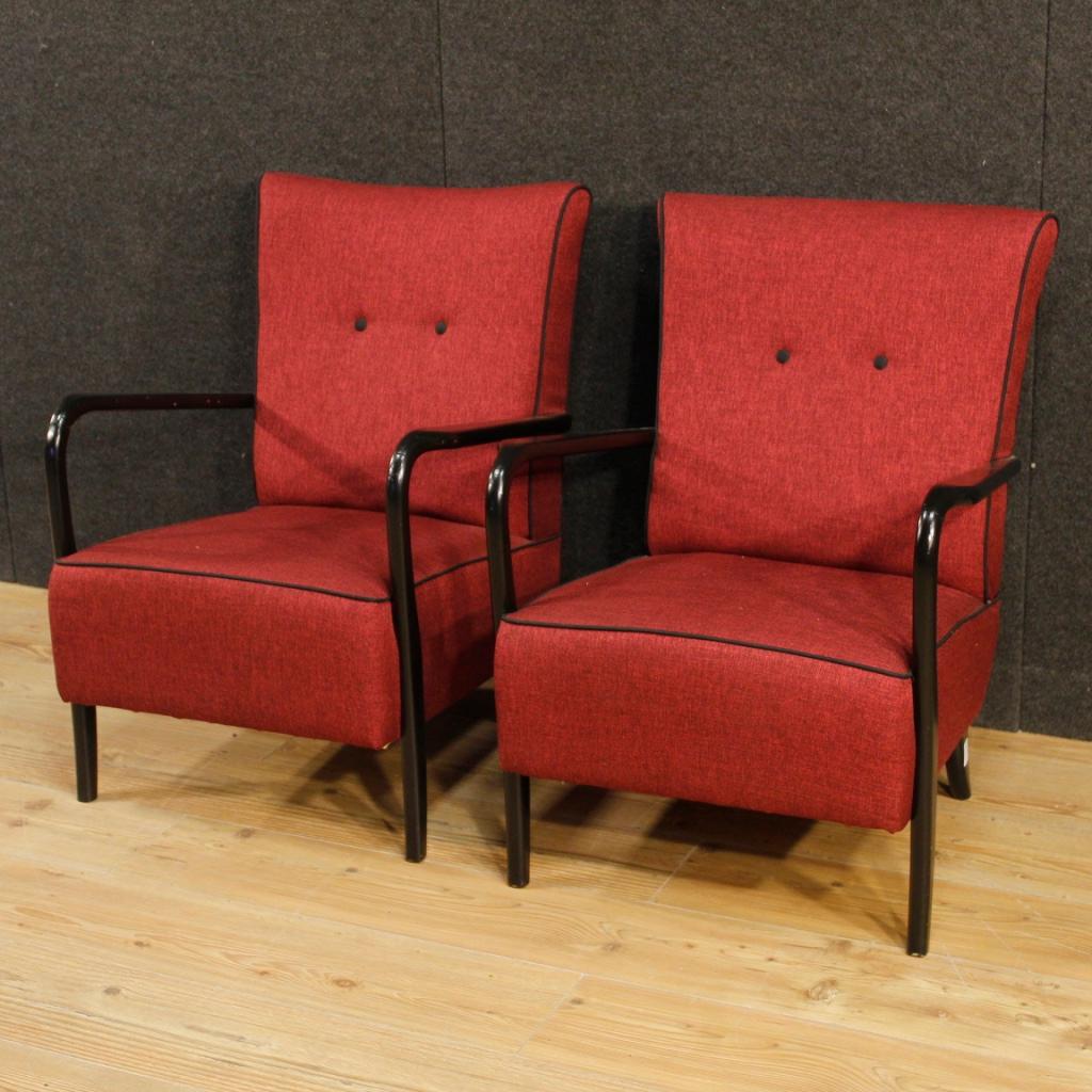 Pair of Italian design armchairs from the mid-20th century. Furniture with armrests and wooden structure, covered in red-purple fabric in excellent condition, recently replaced. Cassina line armchairs for interior designers and lovers of Italian