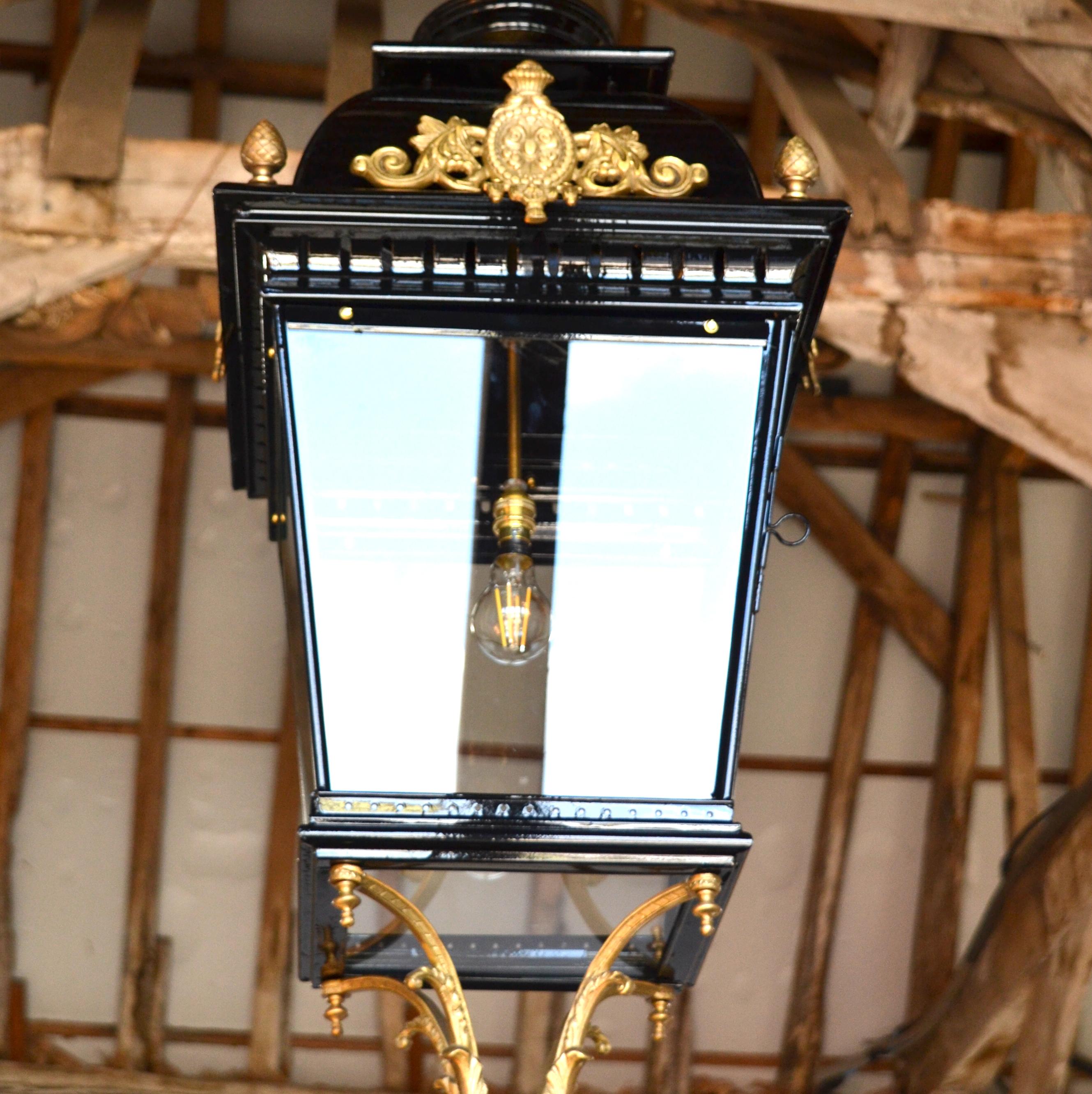 A large hanging Regency Style Lantern, with domed top and cartouche moulding. Cascading on to an Ormolu bracket with pierced acorn finial. 