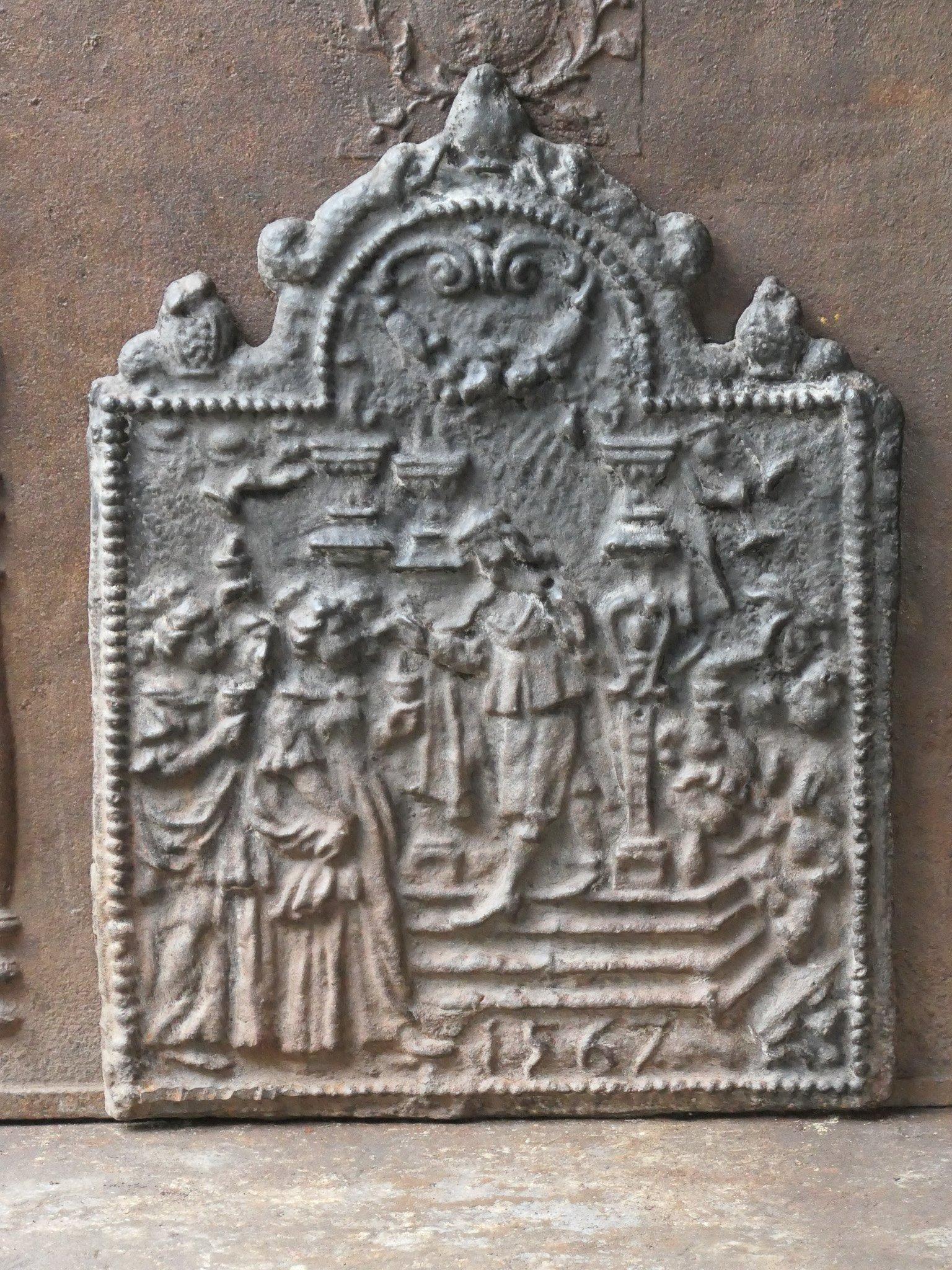 20th century Gothic style fireback depicting a religious theme. The fireback is made of cast iron and has a natural brown patina. Upon request it can be made black / pewter. The fireback is in good condition and does not have cracks.