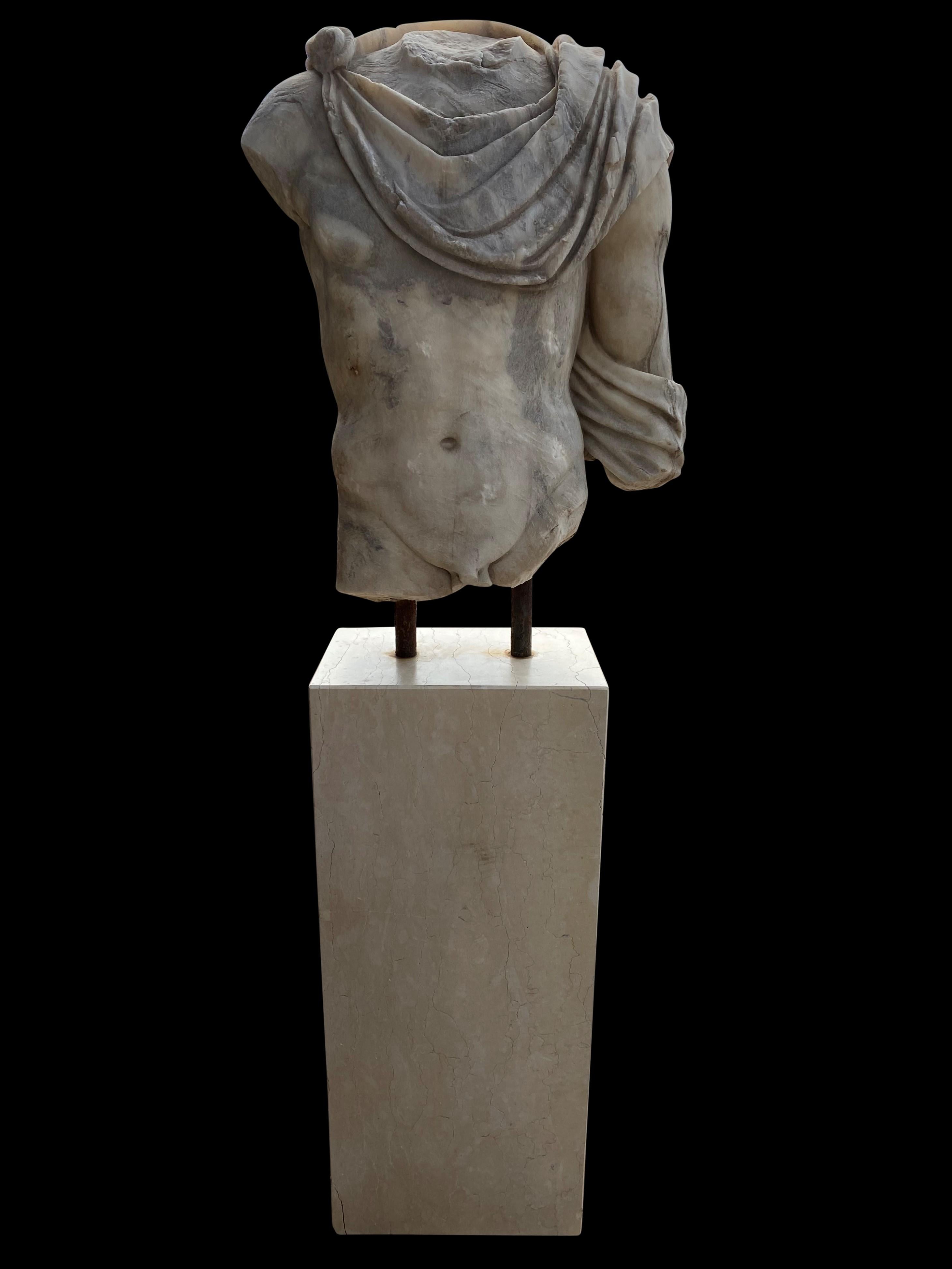 A stunning 20th century hand carved Replica of Greek Roman Marble Torso.
Torso of a man in contrapposto. Engaged left leg. Clearly defined musculature with pronounced inguinal folds. Pubis articulated. Roman copy after a Greek statue type of the