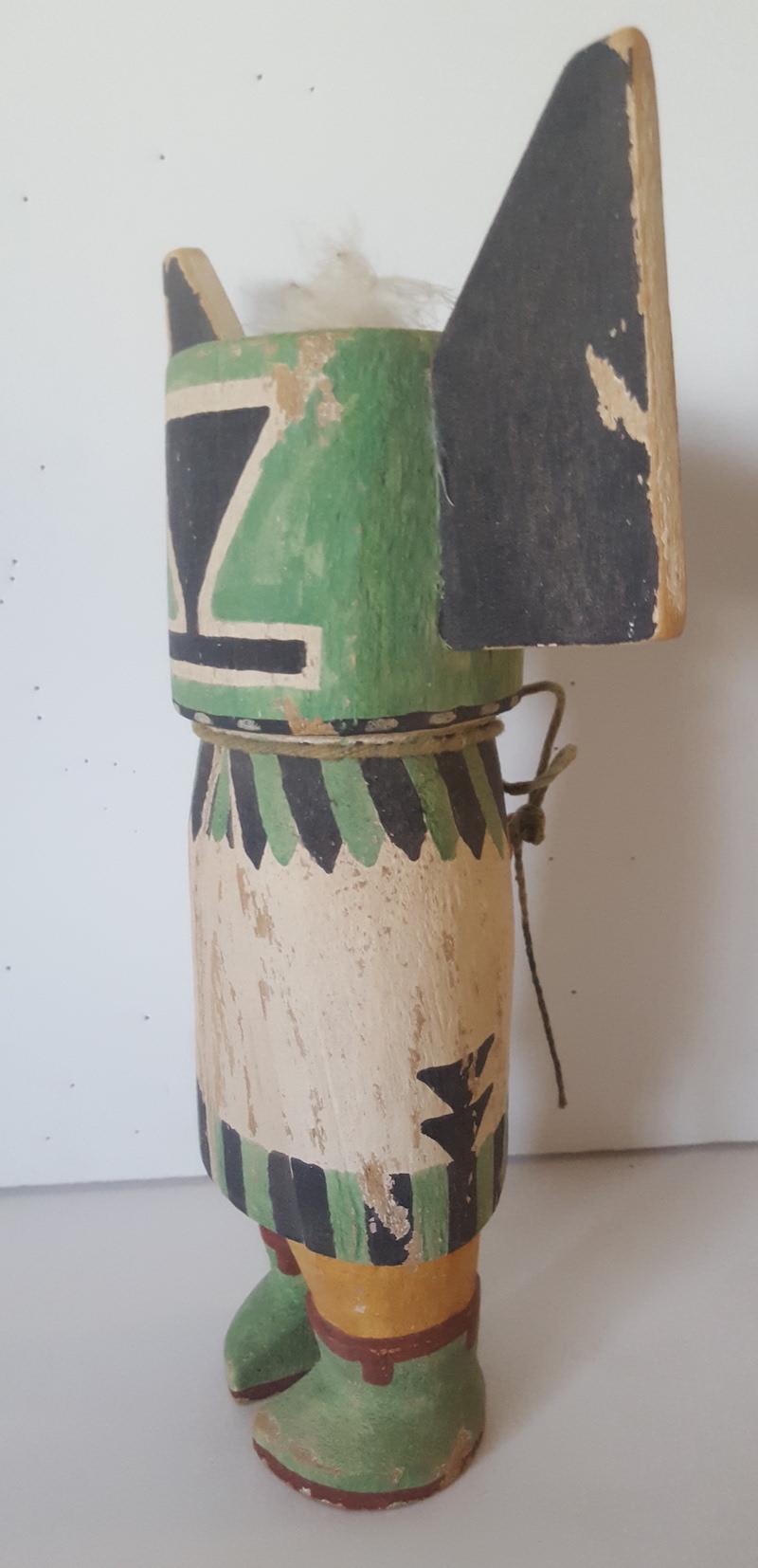 This Hopi, traditional style Kachina Doll was hand-carved and hand-painted circa 1960 by a master maker of replica, as well as more original versions of classic, vintage Kachinas. It is carved of traditional cottonwood and painted with the similar