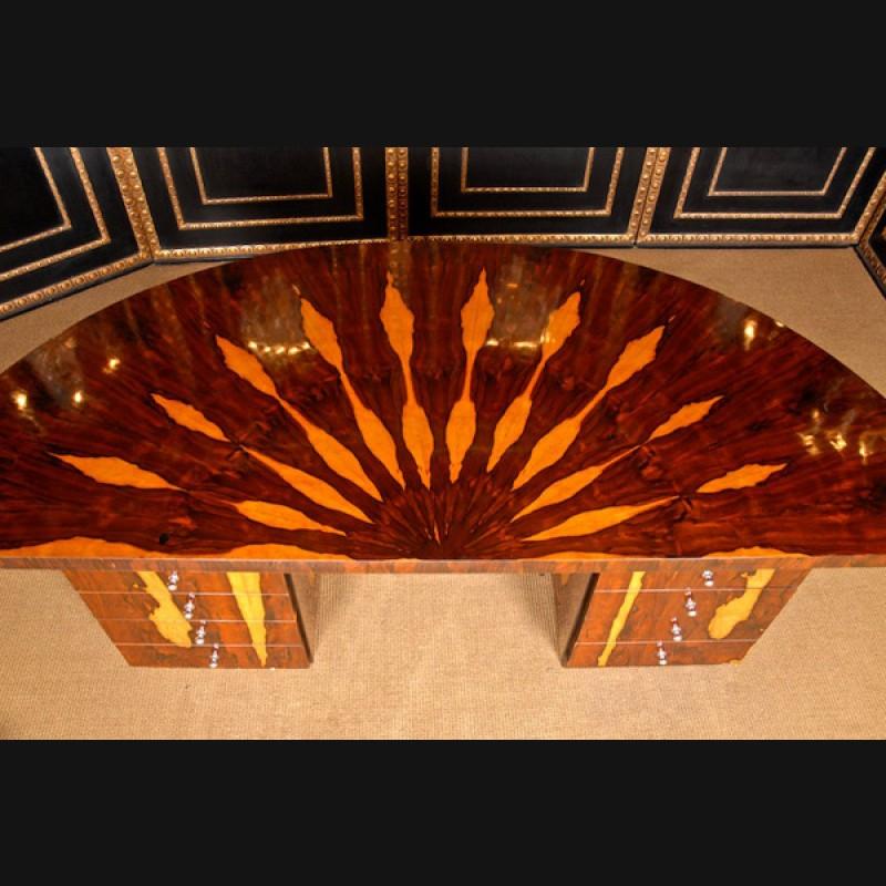 20th century representative monumental Art Deco desk
 tulipwood veneer on wood. Half-arched cover plate on two-part straight body, middle knee compartment. Box-shaped body on frame base. There are four drawers on each side and a pull-out compartment