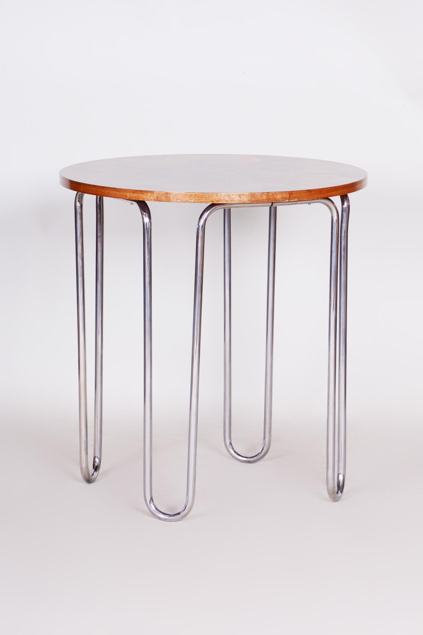 Bauhaus chrome table
Style: Bauhaus.
Period: 1930-1939. 
Material: Walnut and chrome-plated steel
Source: Czechia.





