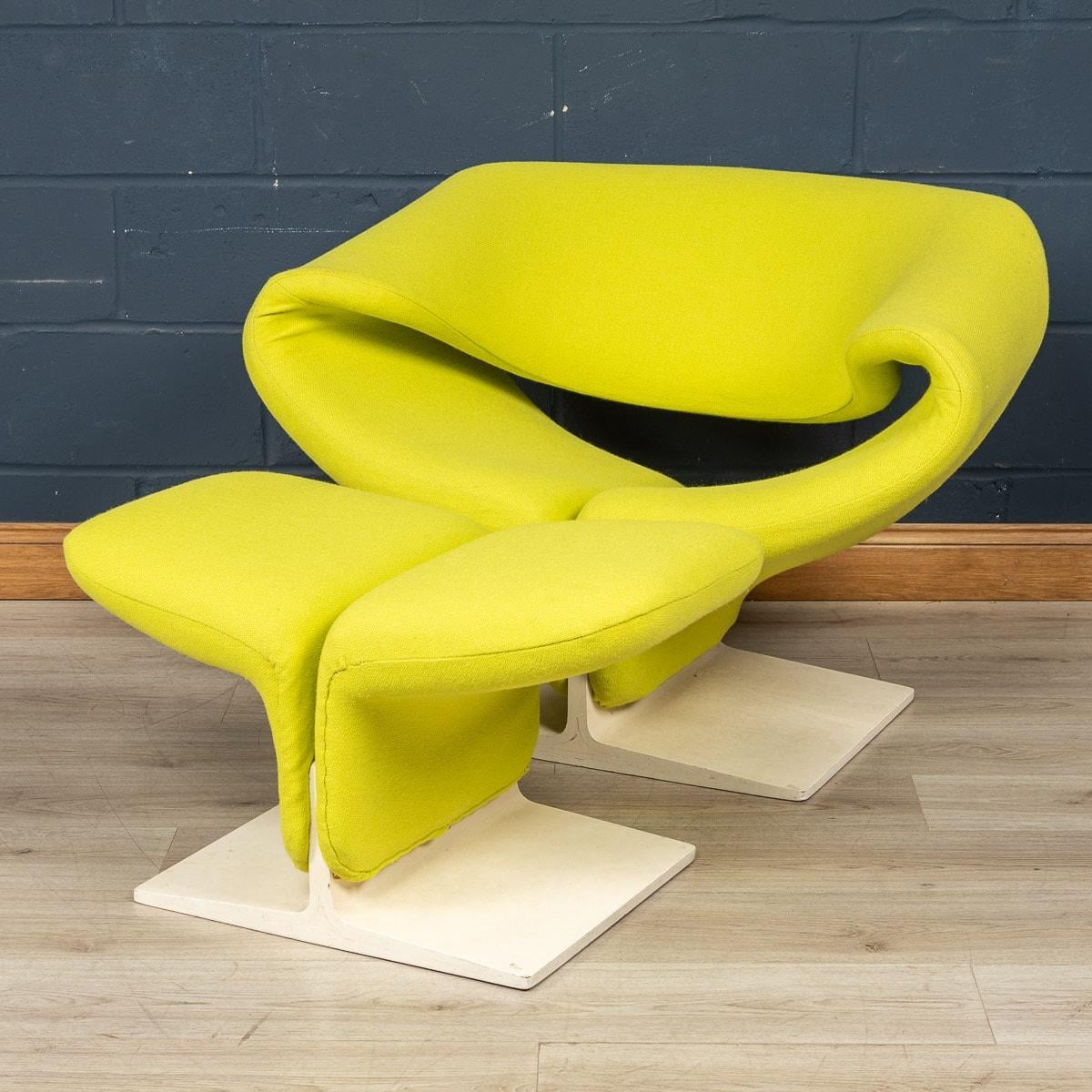 A rare “Ribbon” chair and footstool, originally designed 1960s by Pierre Paulin for Artifort, France. Of sculptural form with lime green wool upholstery and white painted wood, these items are a true statement piece and a testament to Pierre