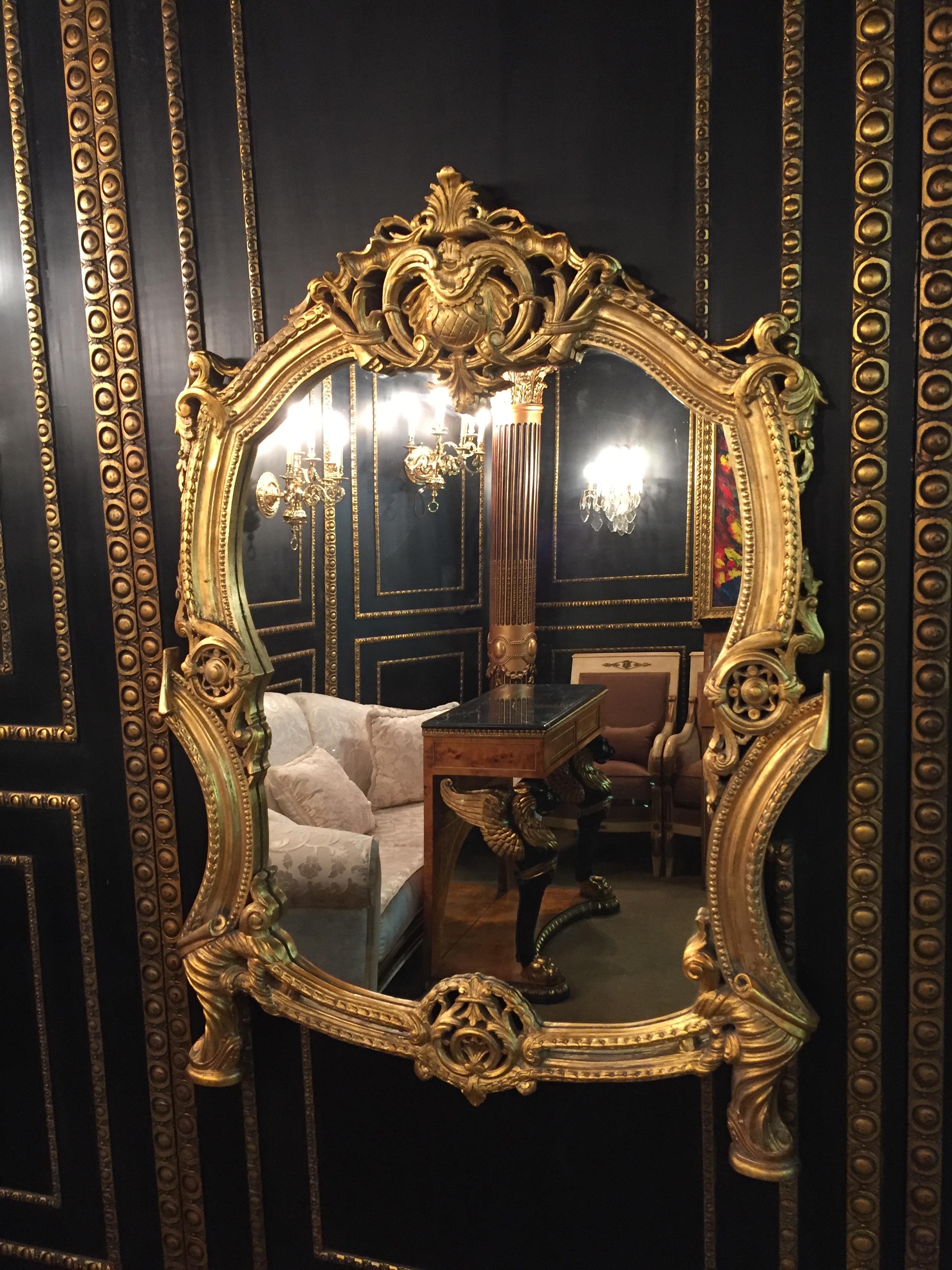 Splendid Rococo wall-mirror with Gold leaf. Solid beechwood, finely carved, hand painted and gilded.