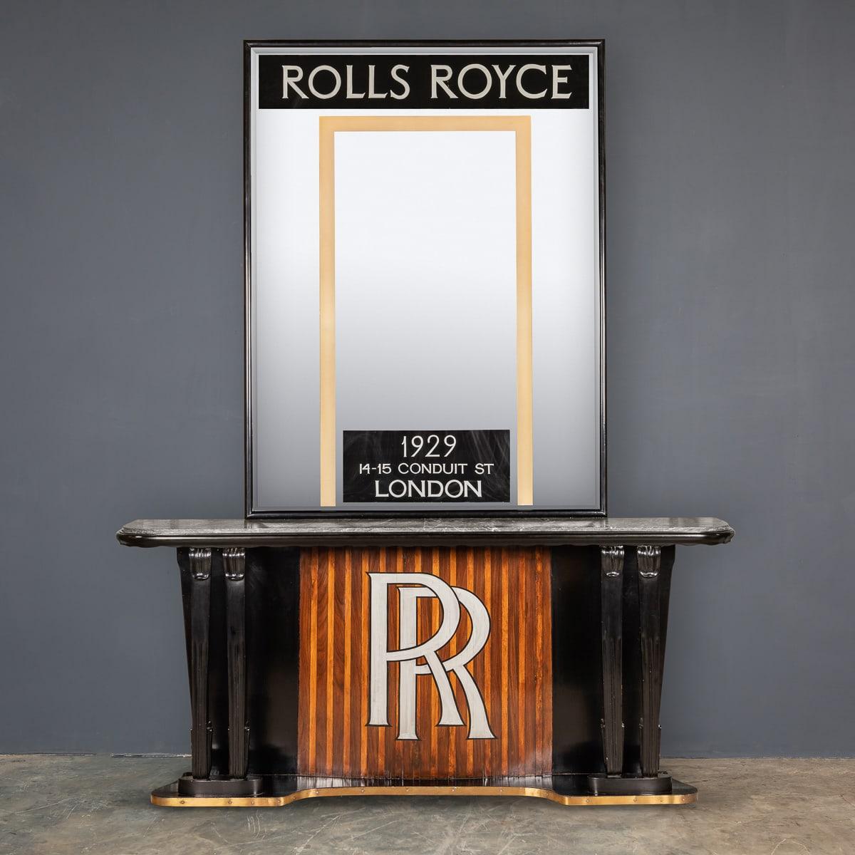 20th century Art Deco console & mirror, made from ebonised mahogany with a panel of sycamore and mahogany stripes between carved cabriole legs, rose pink Italian marble and finished with brass trim at floor level for added protection, this suggests