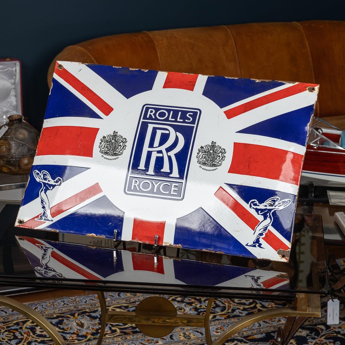 A 20th Century British Union Jack Rolls Royce enamel sign. Of a large size and convex rectangular shape, this advertising sign would have once been proudly situated in front of a dealership or garage which serviced or sold Rolls Royce motor cars.