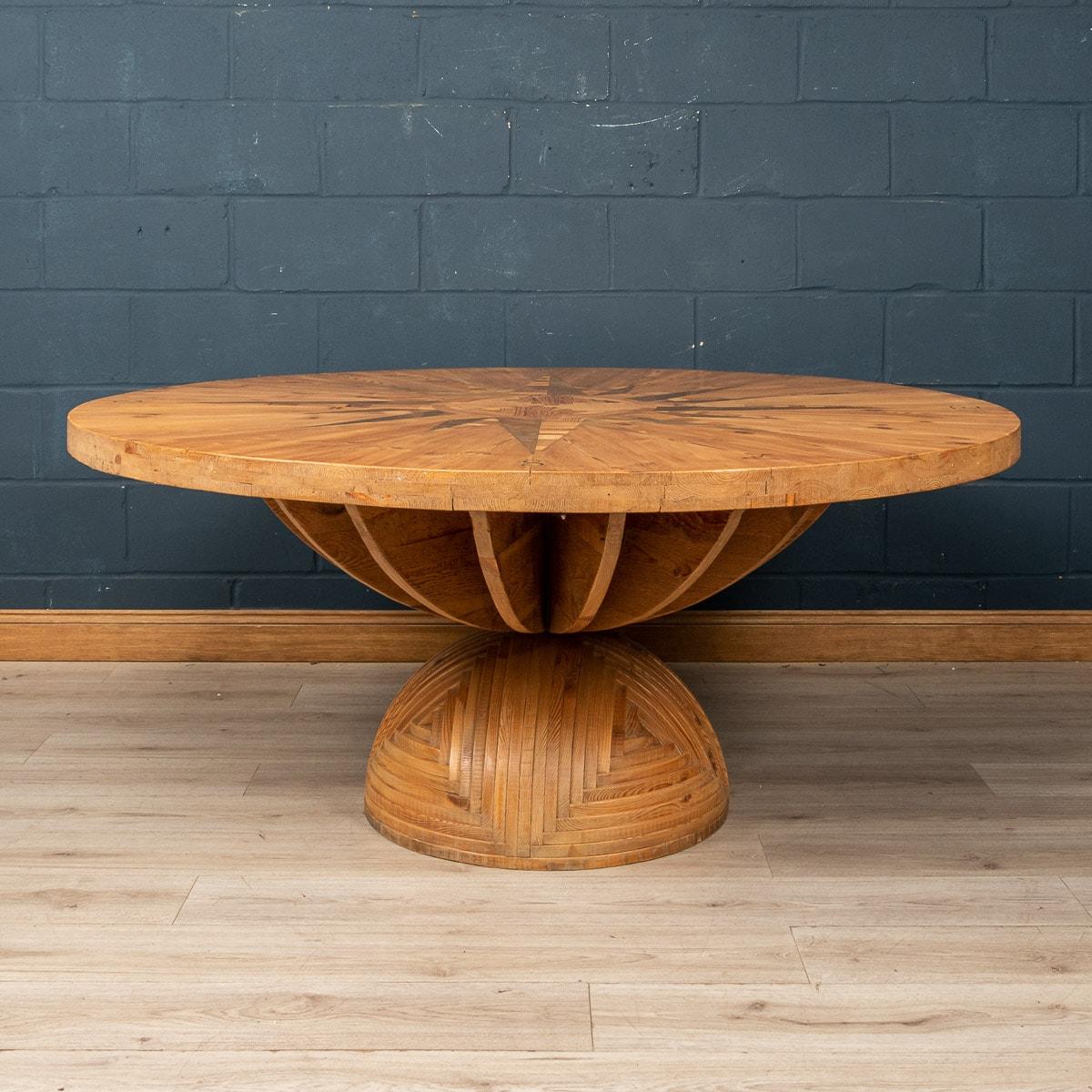 A stunning “Rosa Dei Venti“ table designed by Mario Ceroli and produced by Poltronova. The table is made from intersected pine segments with walnut and pine detailing and bronze inserts denoting the four compass points. This is one of the earliest