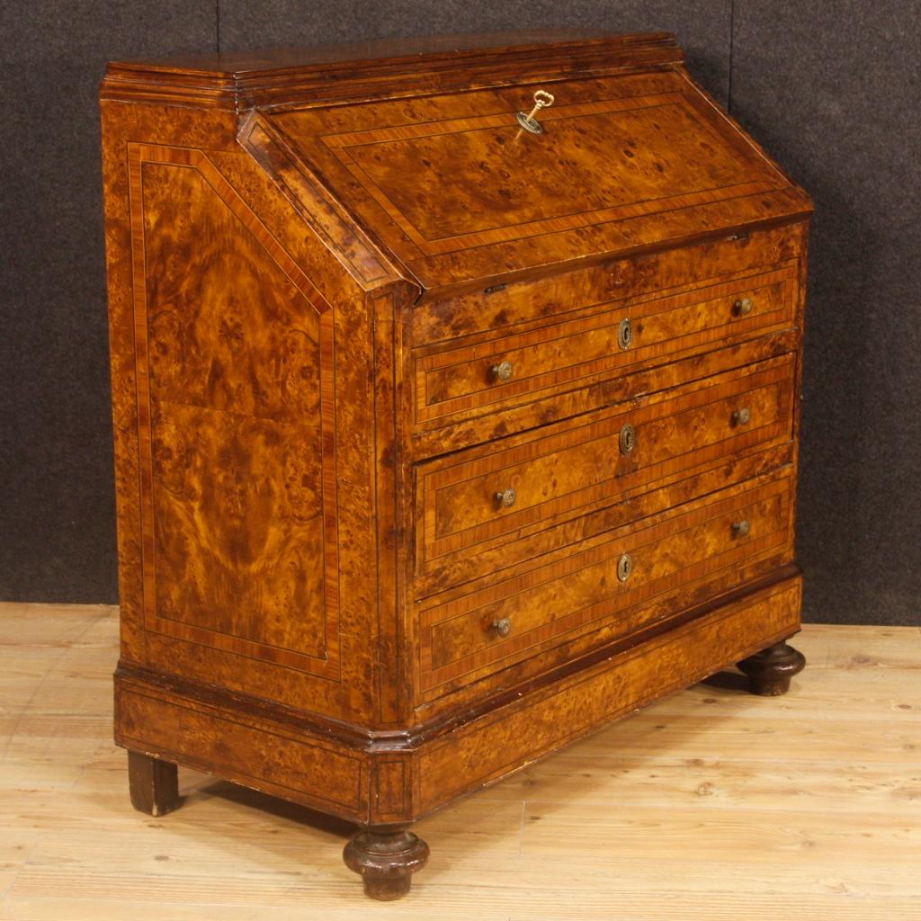 Italian bureau from the mid-20th century. Furniture of nice decor in wood of rosewood, ebonized wood and elm burl. Bureau with three external drawers of good capacity. Fall-front offering inside a writing desk of good service, four drawers and a