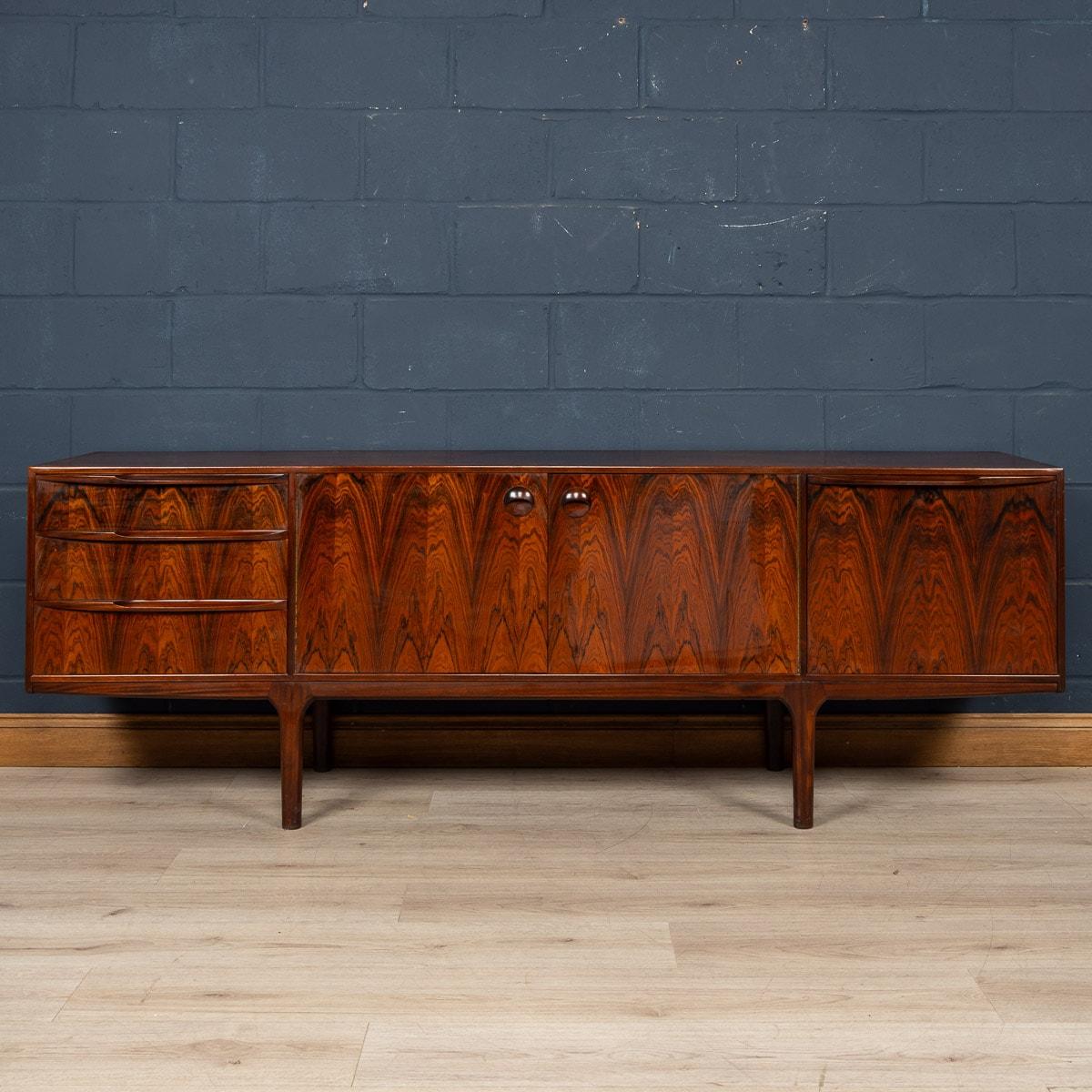 A beautifully designed rosewood ‘Dunvegan’ sideboard designed by Tom Robertson, manufactured by A.H. McIntosh of Kirkcaldy, Scotland. Dating from the 1960s, it was the flagship piece from the Danish-inspired Dunvegan collection. This very