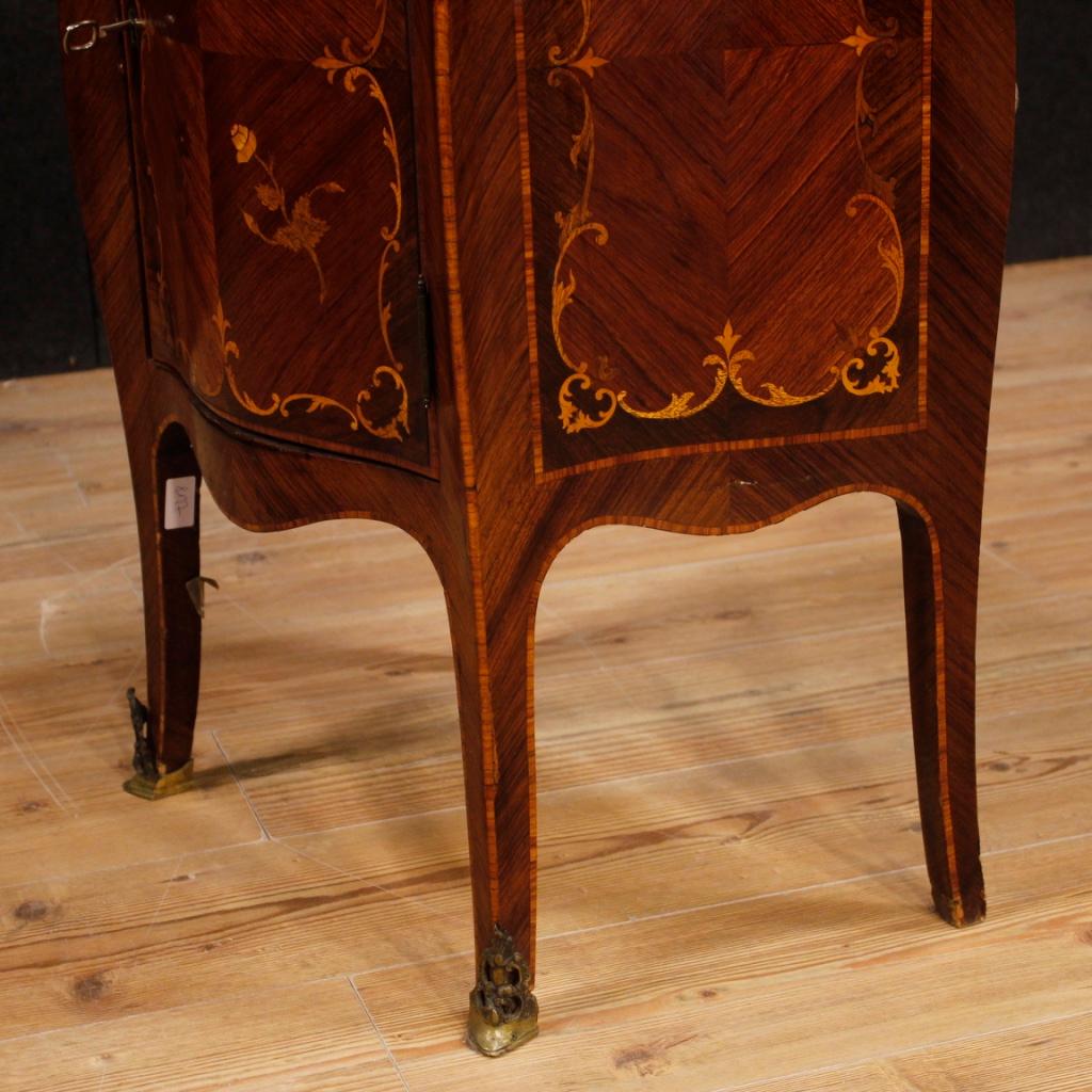 Italian side table from the mid-20th century. Furniture richly inlaid in woods of rosewood, walnut, maple, palisander and fruitwood. Night stand with front door (complete with working key), and an internal shelf. Wooden top in character, of discrete