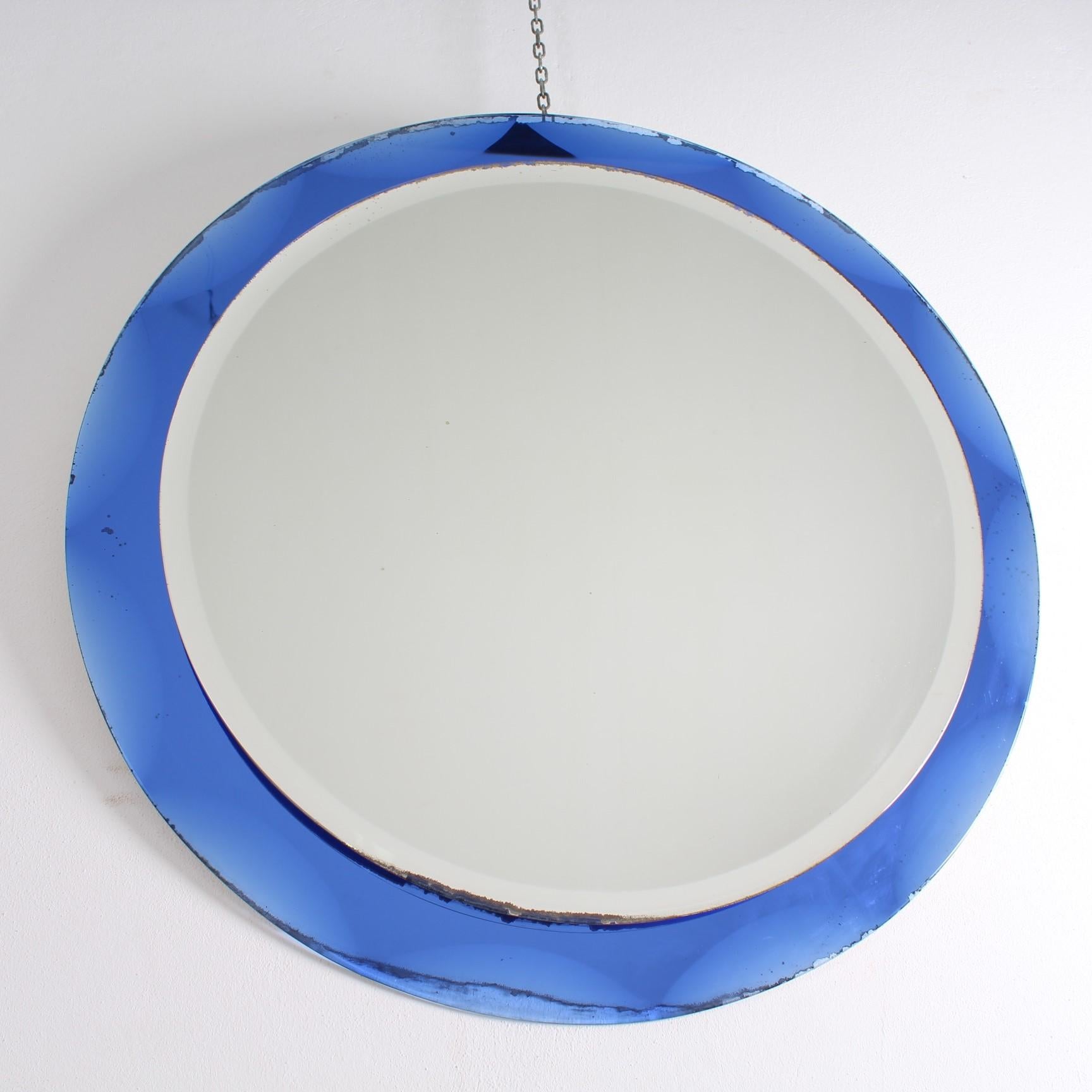 Blue framed Italian mirror
Tiered and shaped Italian mirror. Glass mirror plate sitting on blue mirrored glass. Bevelling to both tiers.
Wear consistent with age and use.
 