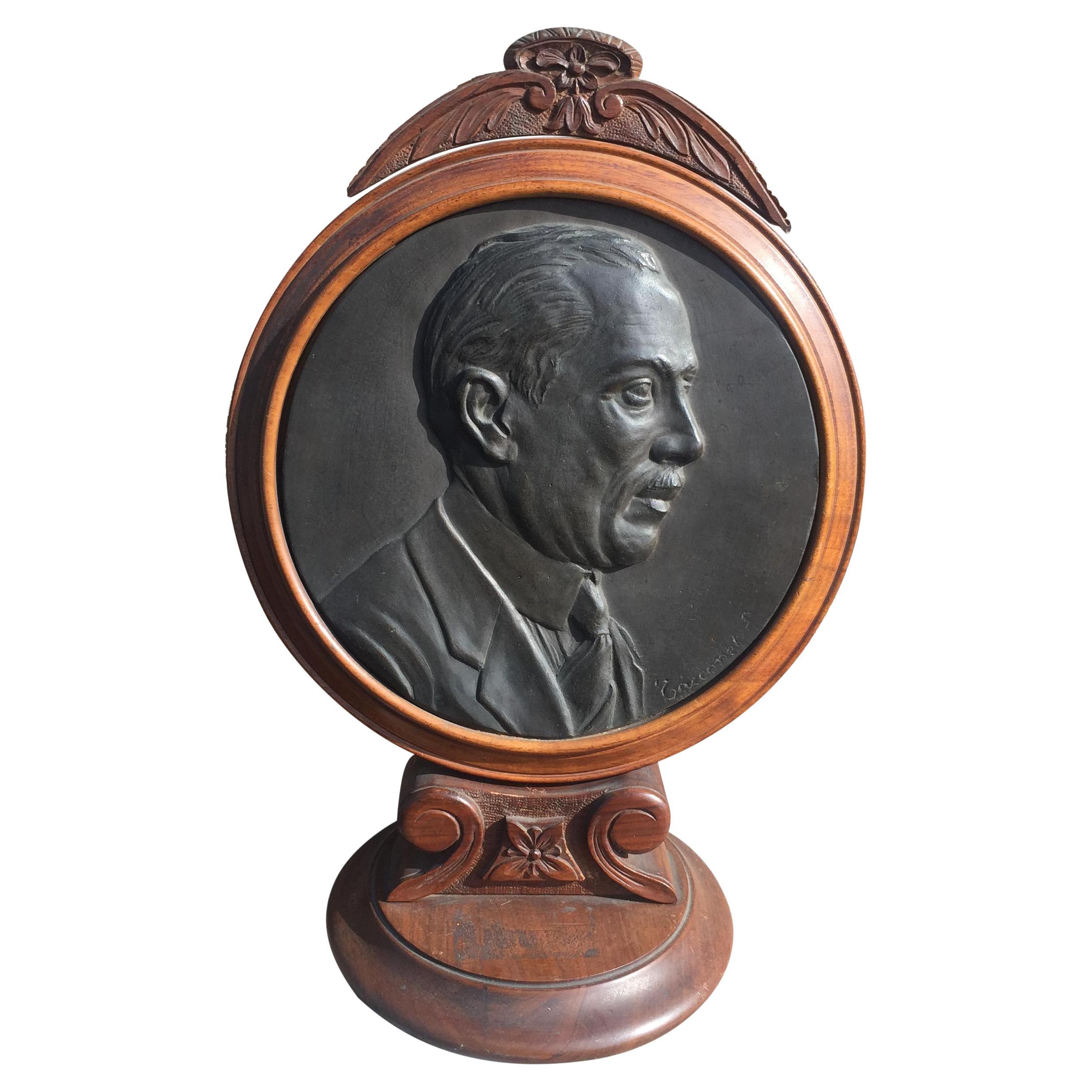 20th Century Round Bronze Plaque Depicting a Male Profile on Wooden Stand For Sale