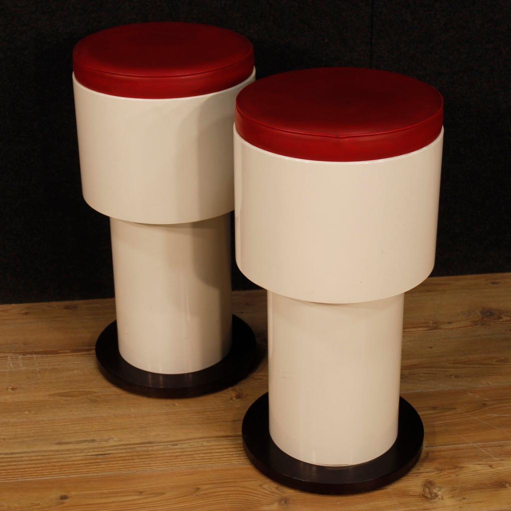 Pair of Italian stools from the 1980s. Furniture of pleasant design, in Joe Colombo style, in resin, veneered base and faux leather cushion. Stools of good comfort with padding in good condition. Seat height of 70 cm. They show some signs of the