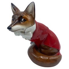  Figurine en os de renard Royal Daulton en manteau de chasse rouge 20ème siècle