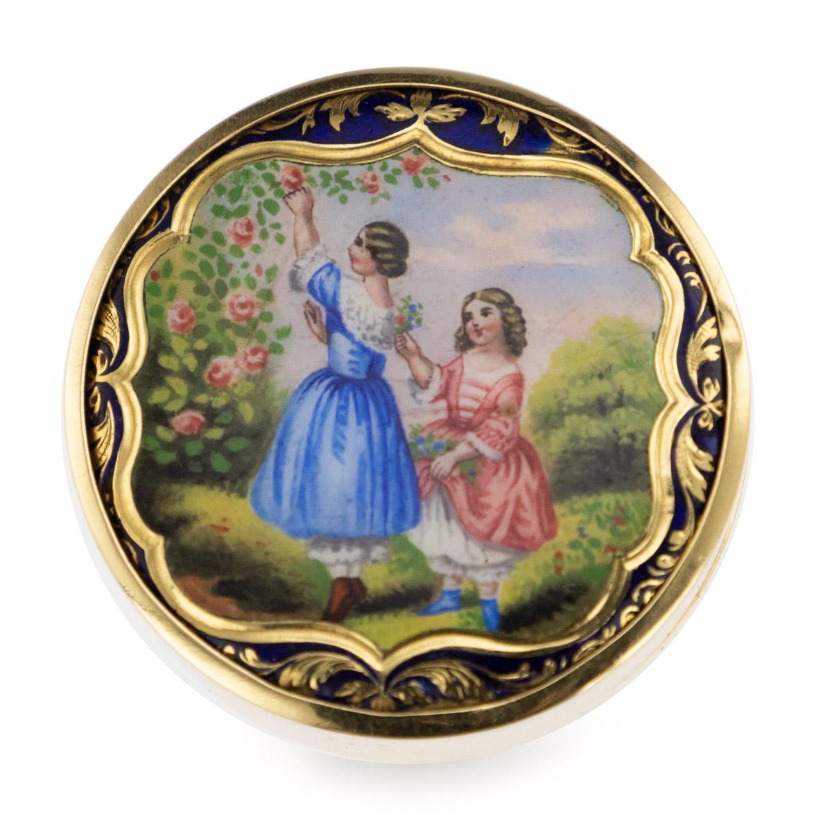 Antique early 20th century Imperial Russian 14-karat solid gold & hand painted enamel pill box, the lid hand painted depicting two sisters picking roses in the garden, within a cartouche shaped reserve, surrounded by blue enamel. Hallmarked Russian