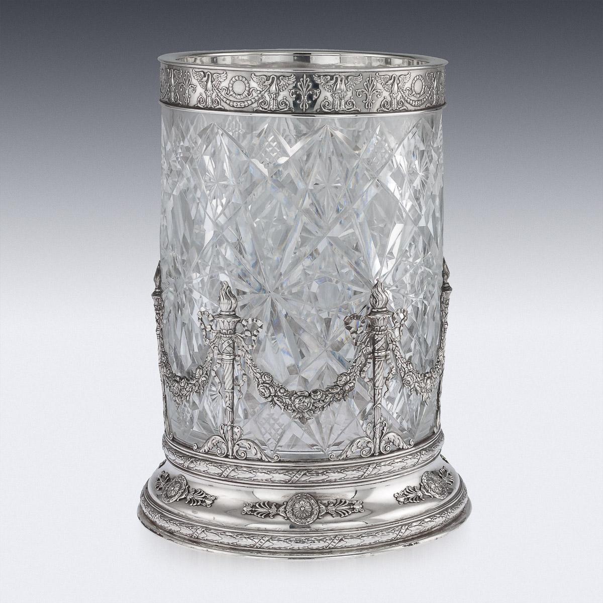 Antique early 20th century Russian Empire style monumental solid silver & cut glass vase, of straight cylindrical form, the glass cut with star facets and ellipses, the base mount applied with intertwining ribbon tied laurel leaf branches, laurel