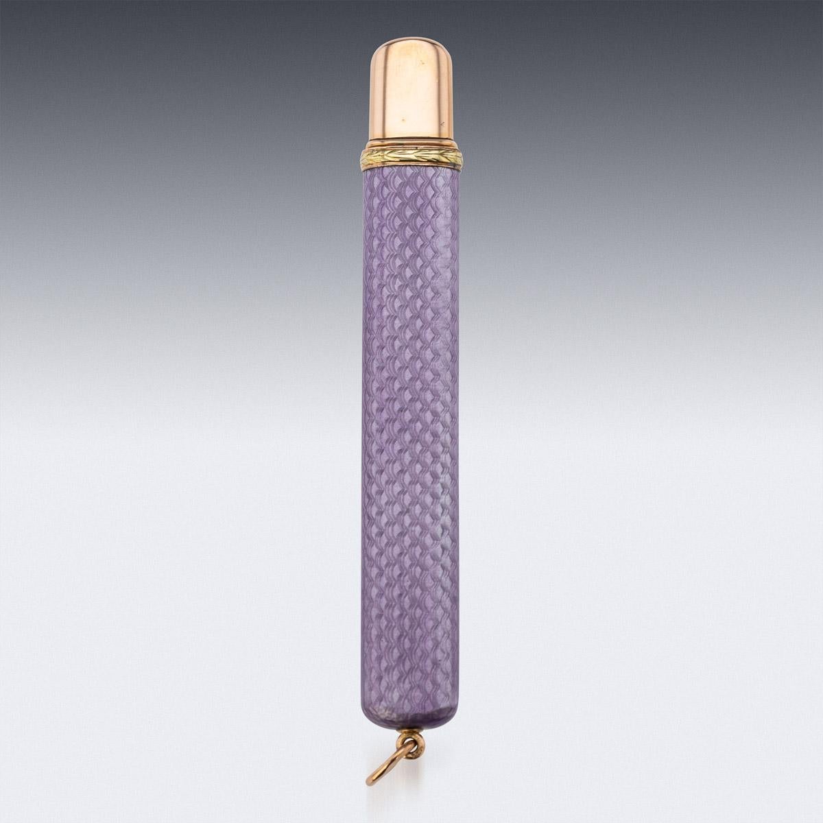Antique early-20th century Imperial Russian two-colour gold-mounted guilloche enamel pencil holder, of flattened rectangular form, enameled in translucent purple over a wavy guilloché ground, the gold collar decorated with gold leaf boarder.