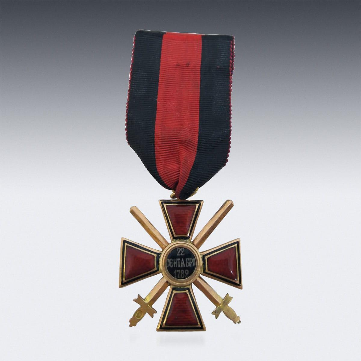 Antique early 20th century Russian Imperial order of St Vladimir, 4th Class (Military Division), the cross covered in translucent red enamel, the front with a coat of arms of St.Vladimir and reverse dated (22nd September 1789). Hallmarked Russian