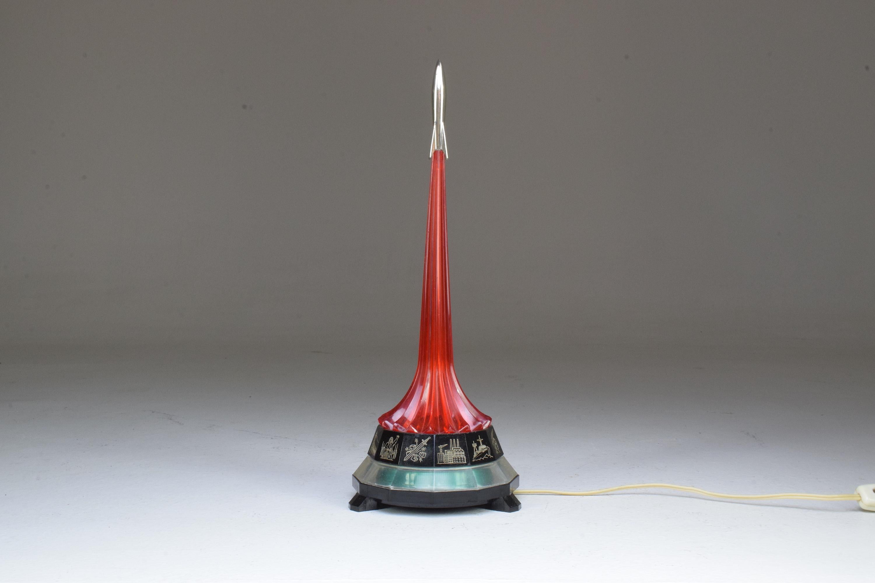 A retro vintage red night light table lamp in the shape of a rocket from the Russian propaganda period and manufacturer at a notable Soviet factory.
Russia, circa 1970s.