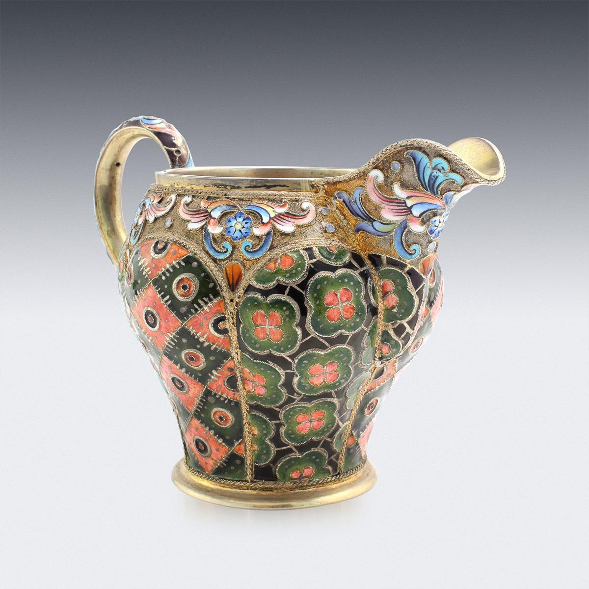 20th century Imperial Russian silver-gilt and cloisonne' enamel sugar bowl and cream jug, particularly large size and fine quality, richly gilt lobed bodies enamelled with conforming geometric and floral patterns in shades of forest green and salmon