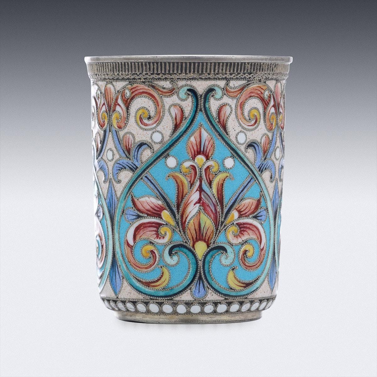 Antique early 20th Century Imperial Russian solid silver & cloisonne enamel beaker, designed upright with a flat base, the body profusely decorated with floral motifs in vary-coloured cloisonné enamel within beaded borders. Hallmarked Russian silver