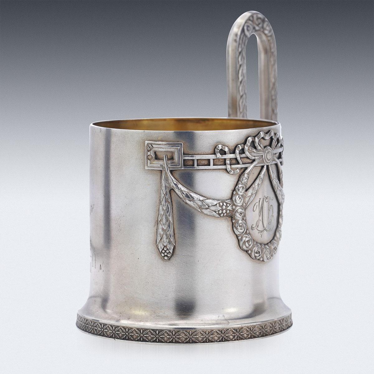 20th century Russian Faberge silver tea glass holder, made in Imperial style, with wreaths and garlands, applied with a solid arching scroll handle decorated with acanthus leaves.
Hallmarked silver 84 (875 standard), Moscow, c.1900, Maker Vasiliy