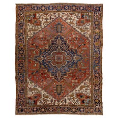 Tapis Heriz ancien en laine rouille du 20ème siècle fabriqué à la main avec un motif de médaillon
