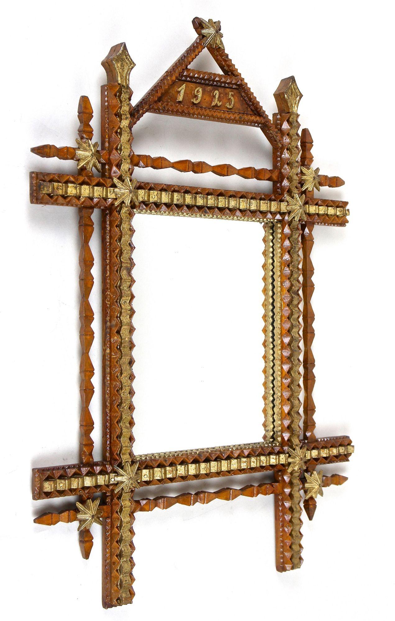 Marvelous looking rustic Tramp Art wall mirror from the early 20th century in Austria. Dated to 1925, this unusual, very detailed 