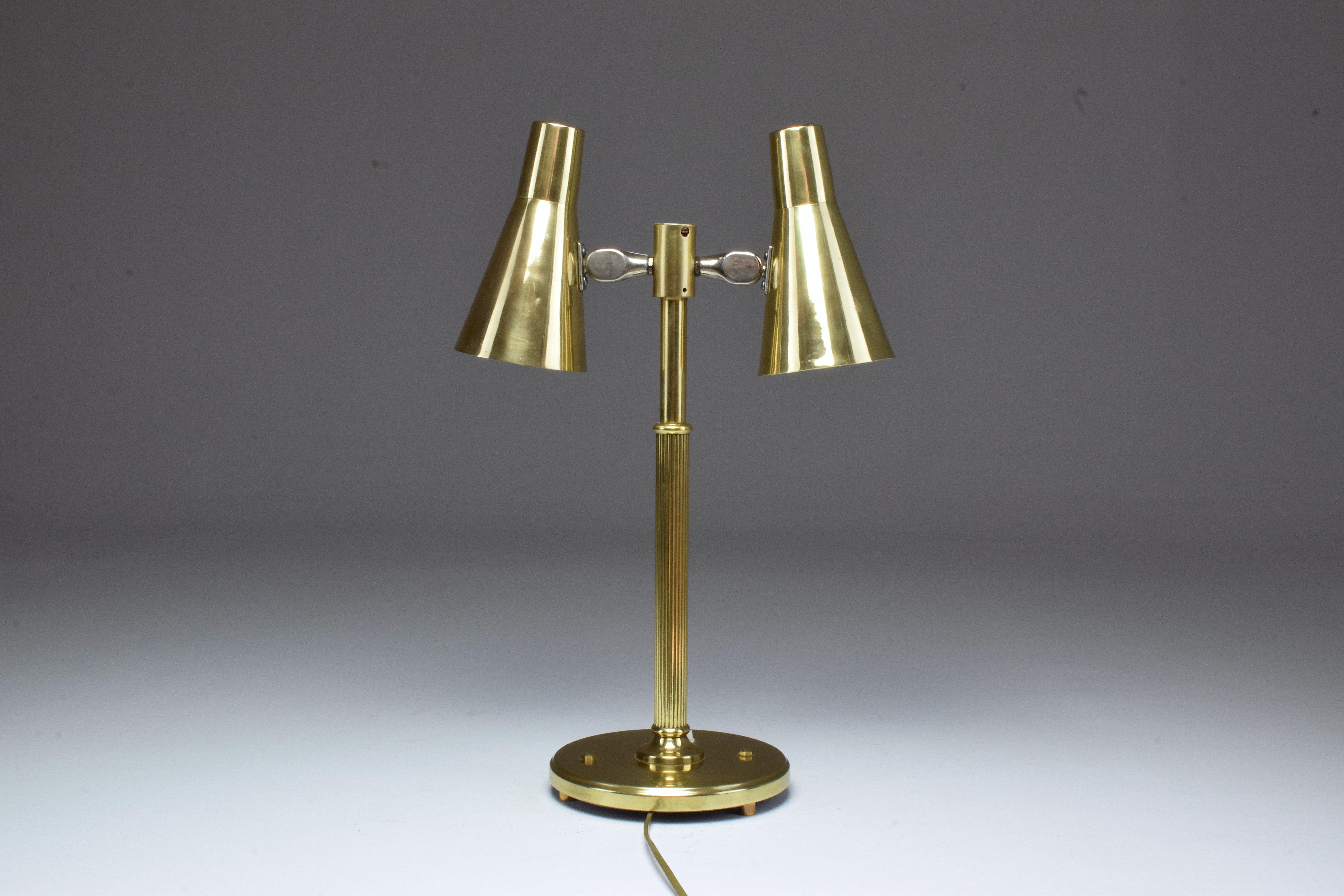 A 20th-century vintage Norwegian table lamp in solid polished gold brass designed with two articulating shade, signed by the manufacturer Sønnico, circa 1960s.

Spirit Gallery is an exhibition space and an online destination established by