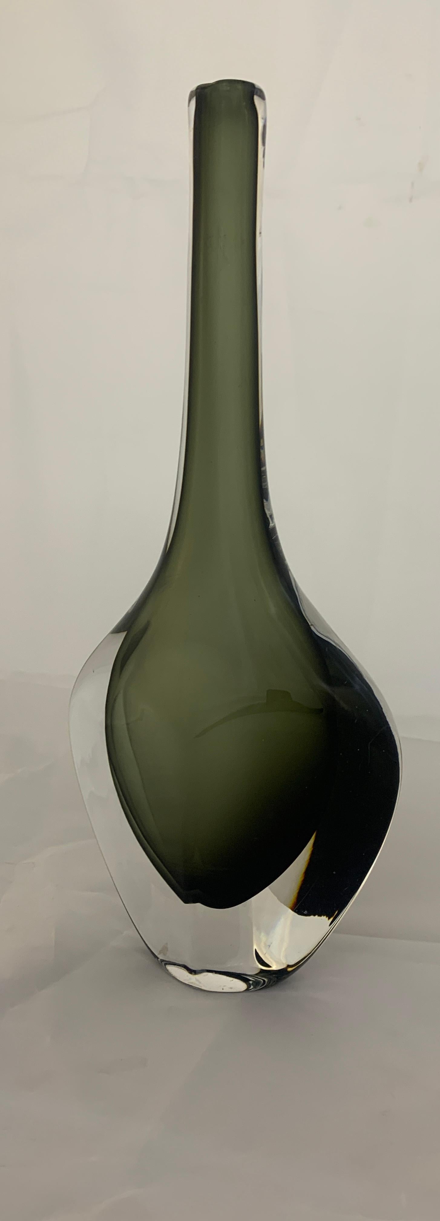 Orrefors glass vase, Dusk series, dark green color on white base. Designer Nils Landberg, vase production 1950-1959.
Signed and numbered on the base. In excellent state of preservation with small scratches. In the 20th century Orrefors would become