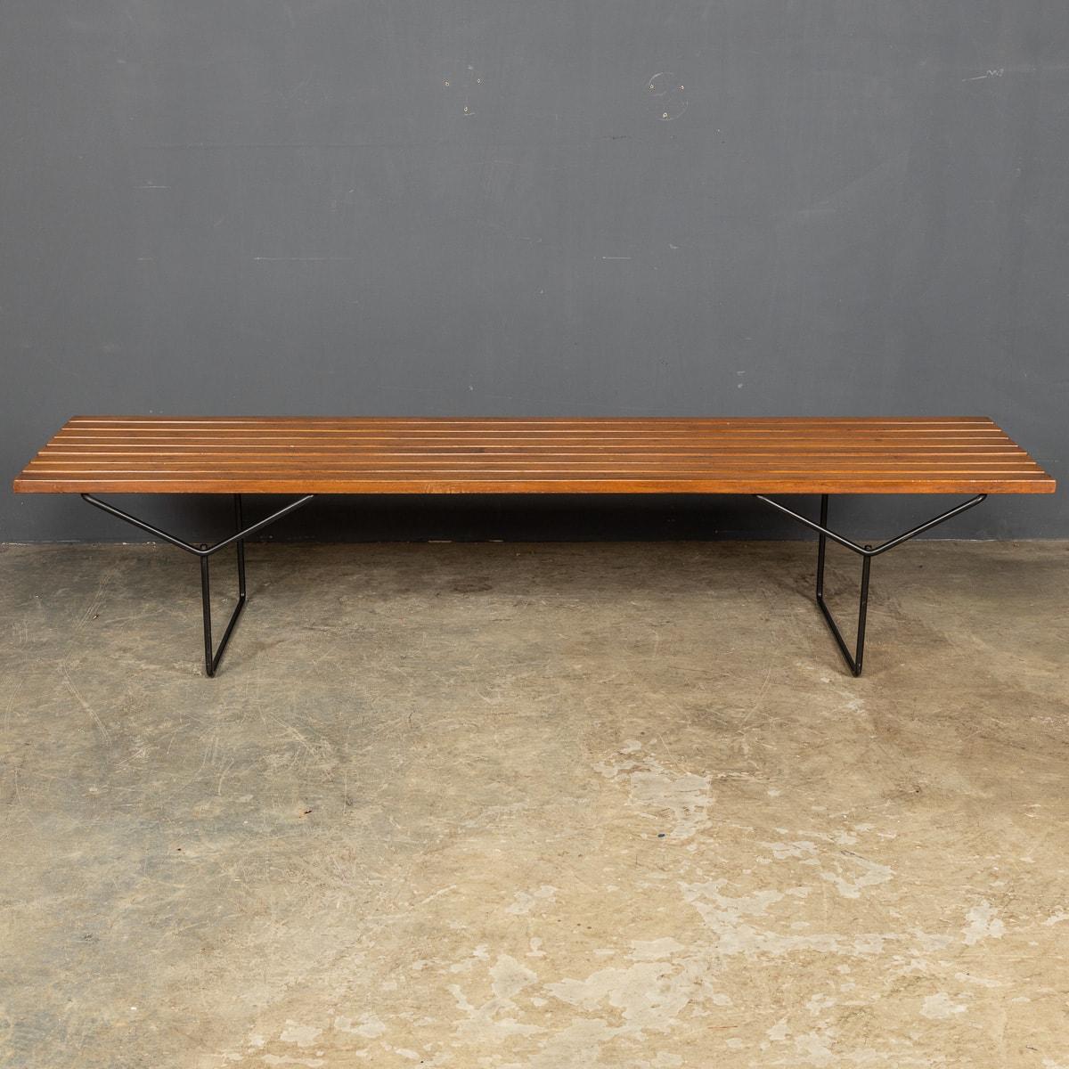 Mid 20th Century Teak slatted bench on a strong thin metal frame, a sleek Scandinavian design.

CONDITION
In Good Condition - wear and tear consistent with age.

SIZE
Width: 182cm
Depth: 47cm
Height: 39cm