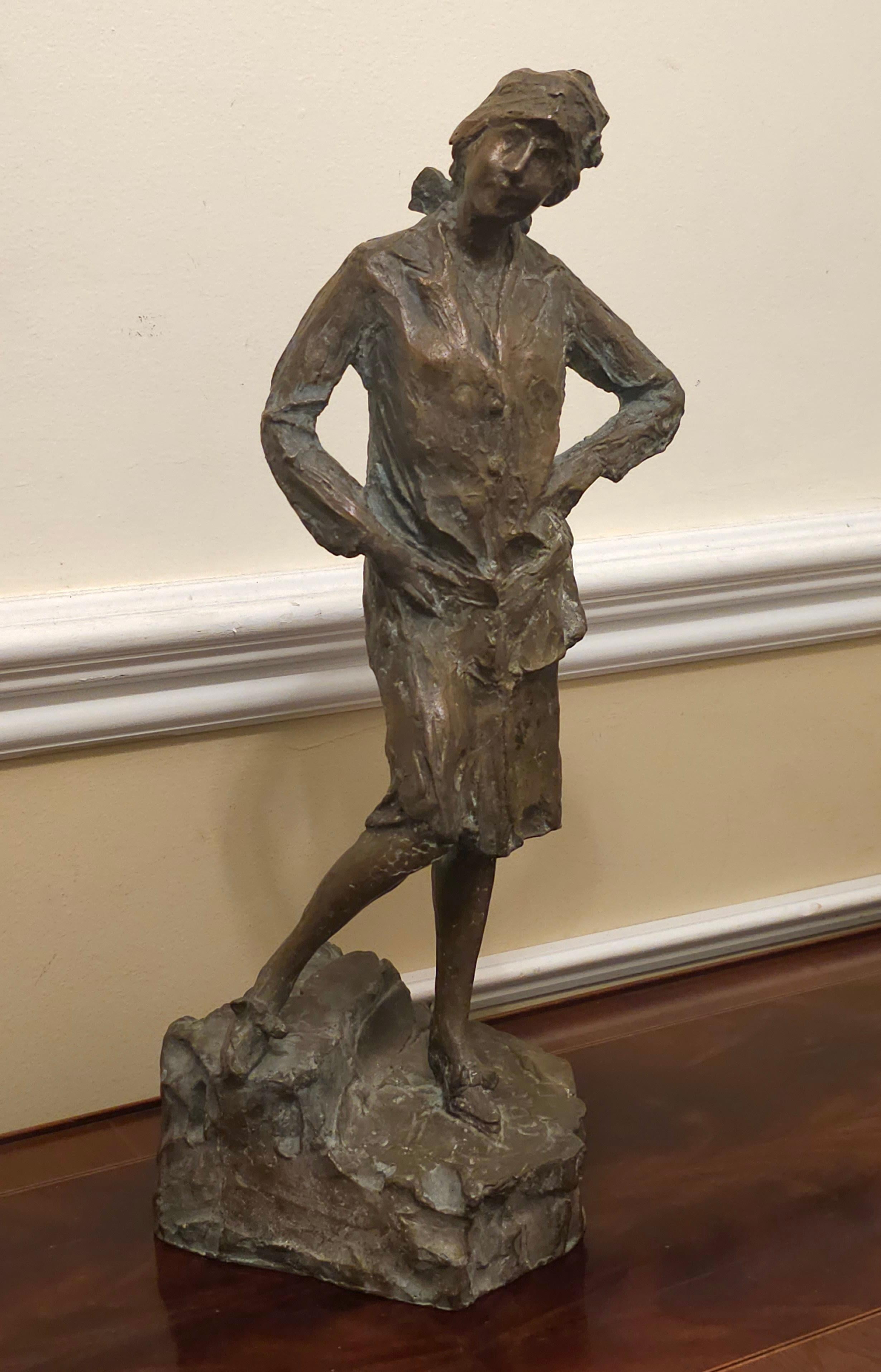 A brutalist bronze sculpture of well dressed standing woman in good vintage condition. 
Measures 6
