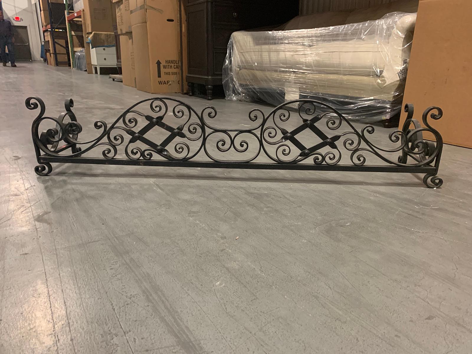 20th century scrolled iron fireplace fender.