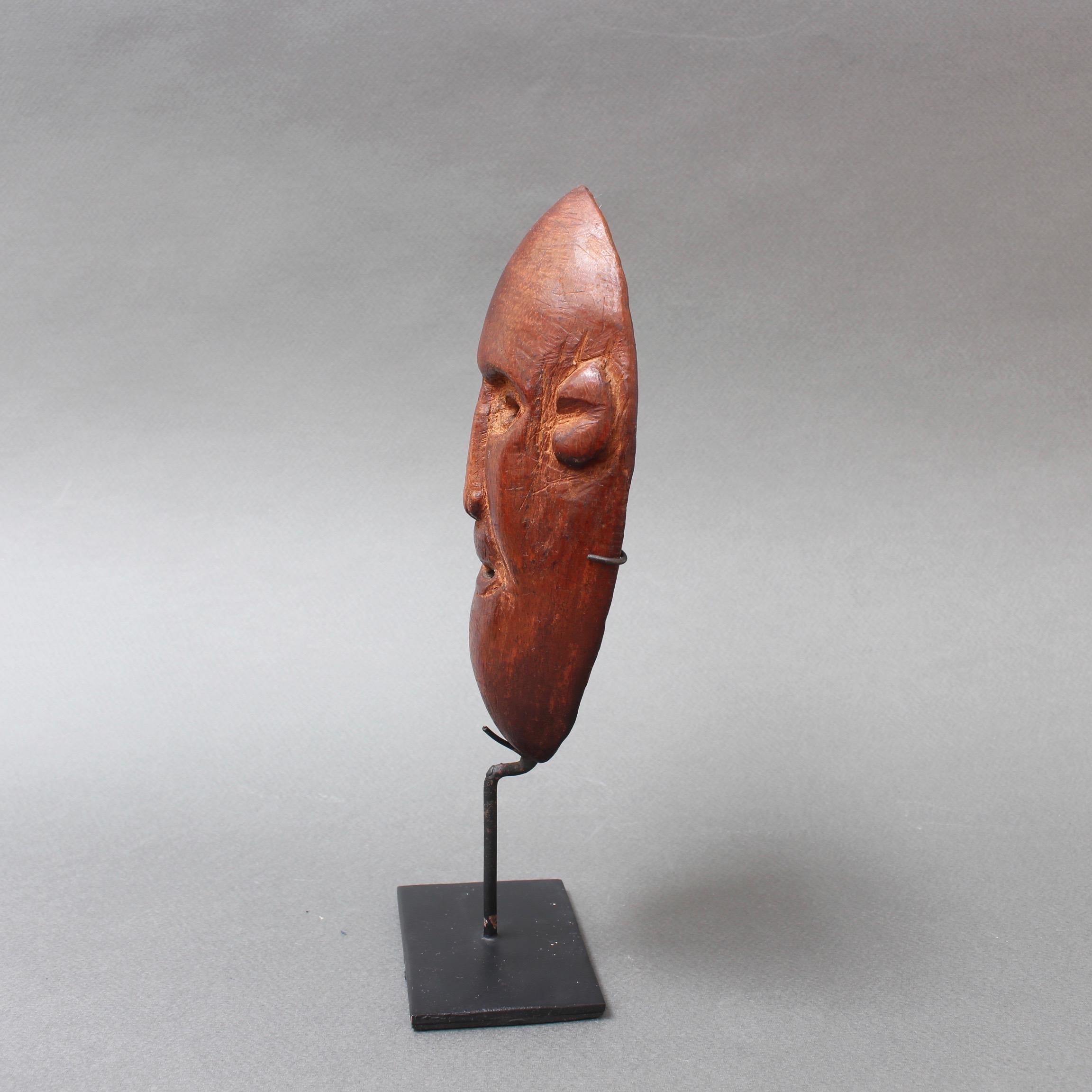 Tribal 20th Century Sculpted Wooden Traditional Mask from Timor Island, Indonesia For Sale