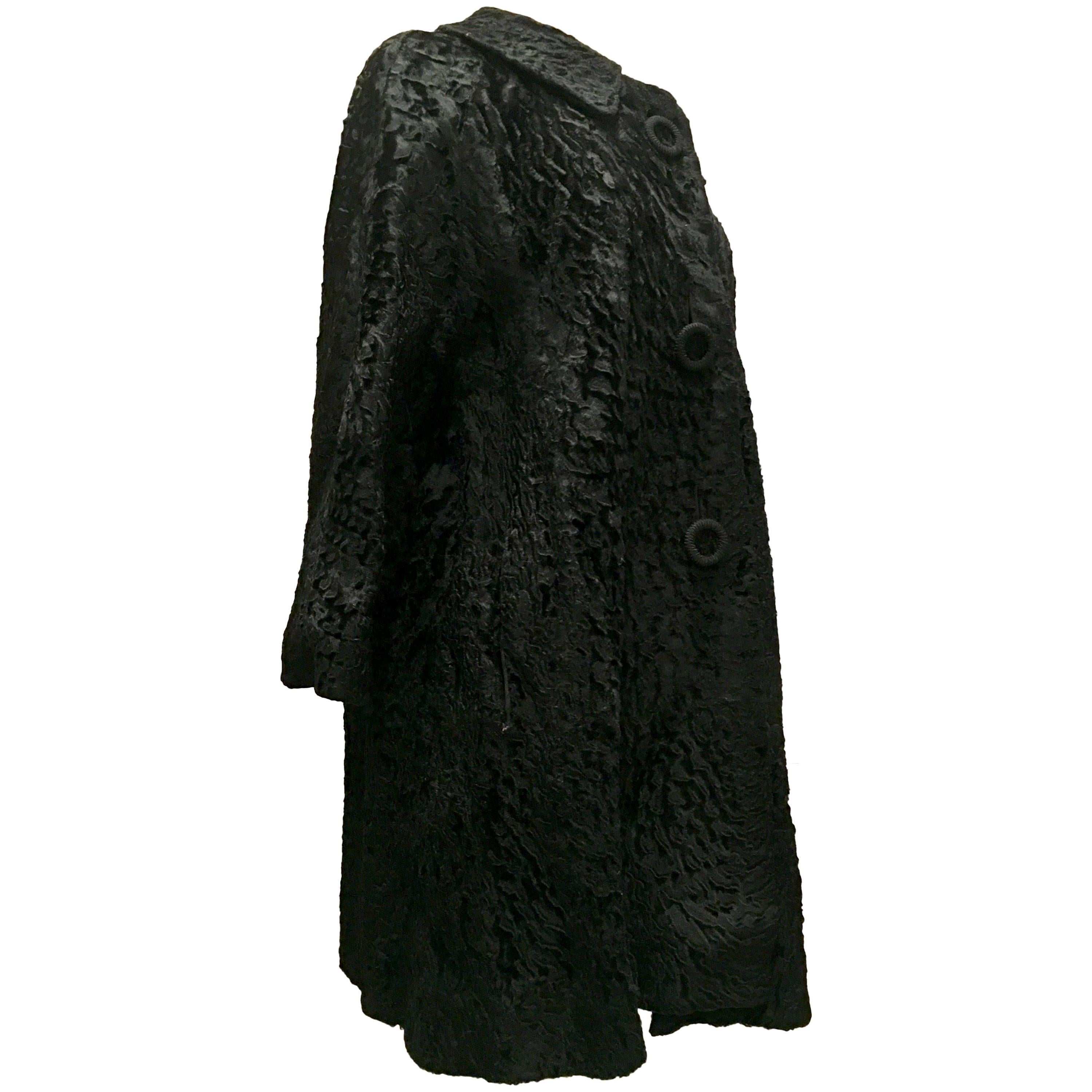 1960'S Black Persian Lamb Fur Swing Coat. Gorgeous jet black sculpted Persian lamb swing style car coat features, adorable oversized made of lamb buttons, Peter Pan Collar, three quarter inch bell sleeves,  two exterior side pockets. Fully lined