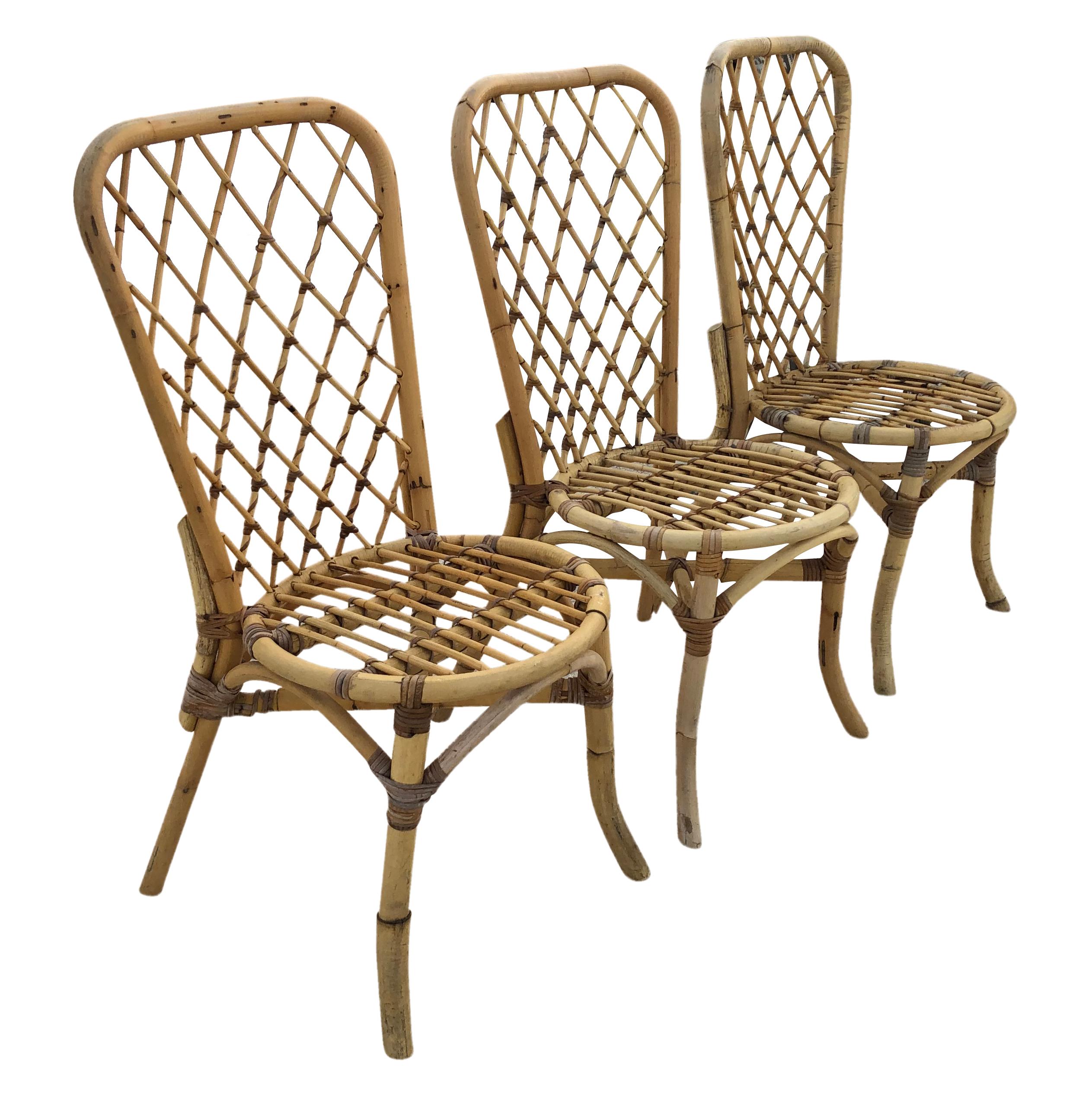 A vintage set of eight Mid-Century Modern Italian bamboo rattan cane dining chairs with high backrest. In very good condition with a sculptural design in the style of Franco Albini. Wear consistent with age and use, circa 1960, Italy.

Measures: