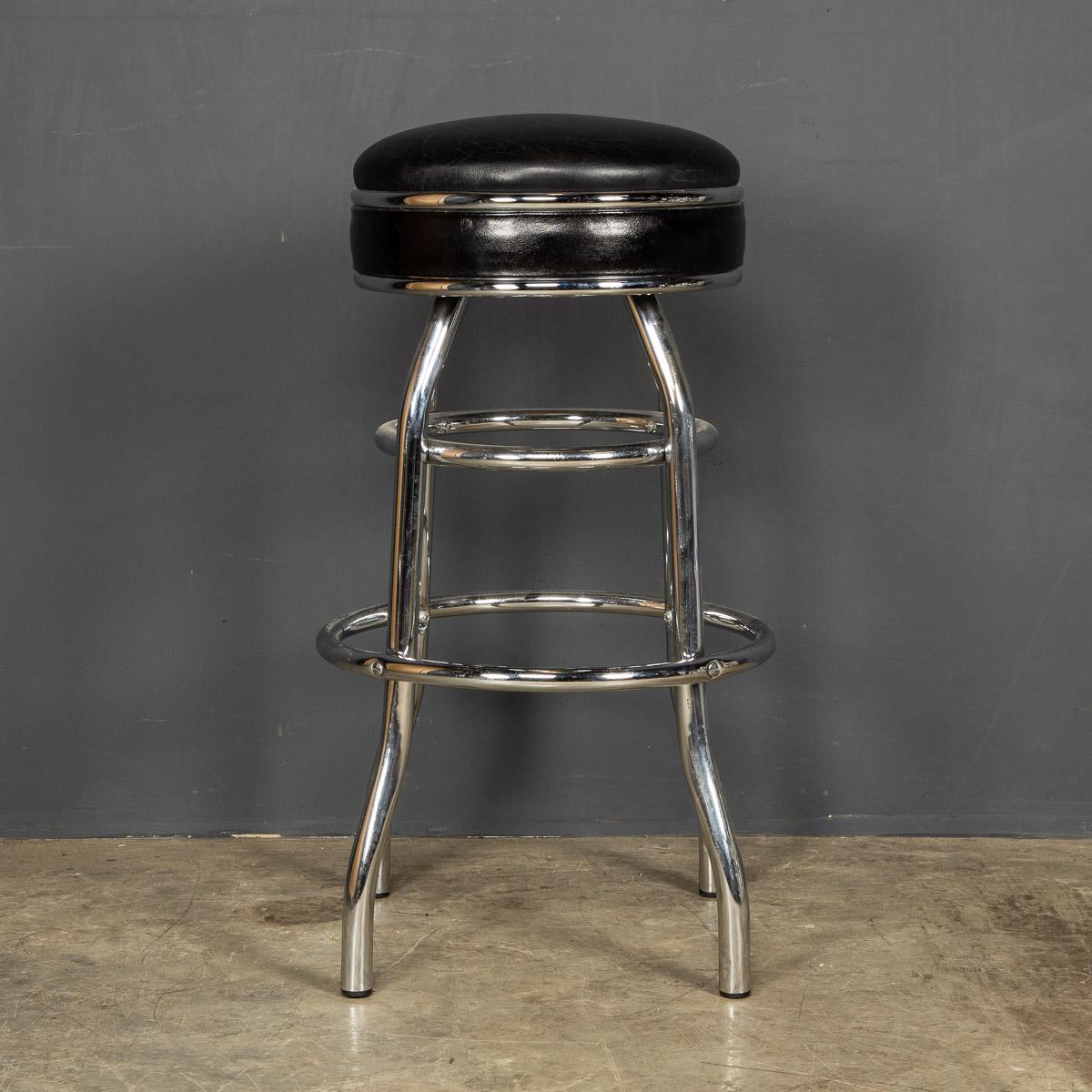 A mid 20th Century set of four leather and chrome swivel top bar stools straight from an iconic American diner.

Condition
In Great Condition - The leather has some wear consistent with age

Size
Height: 78cm
Depth: 50cm.