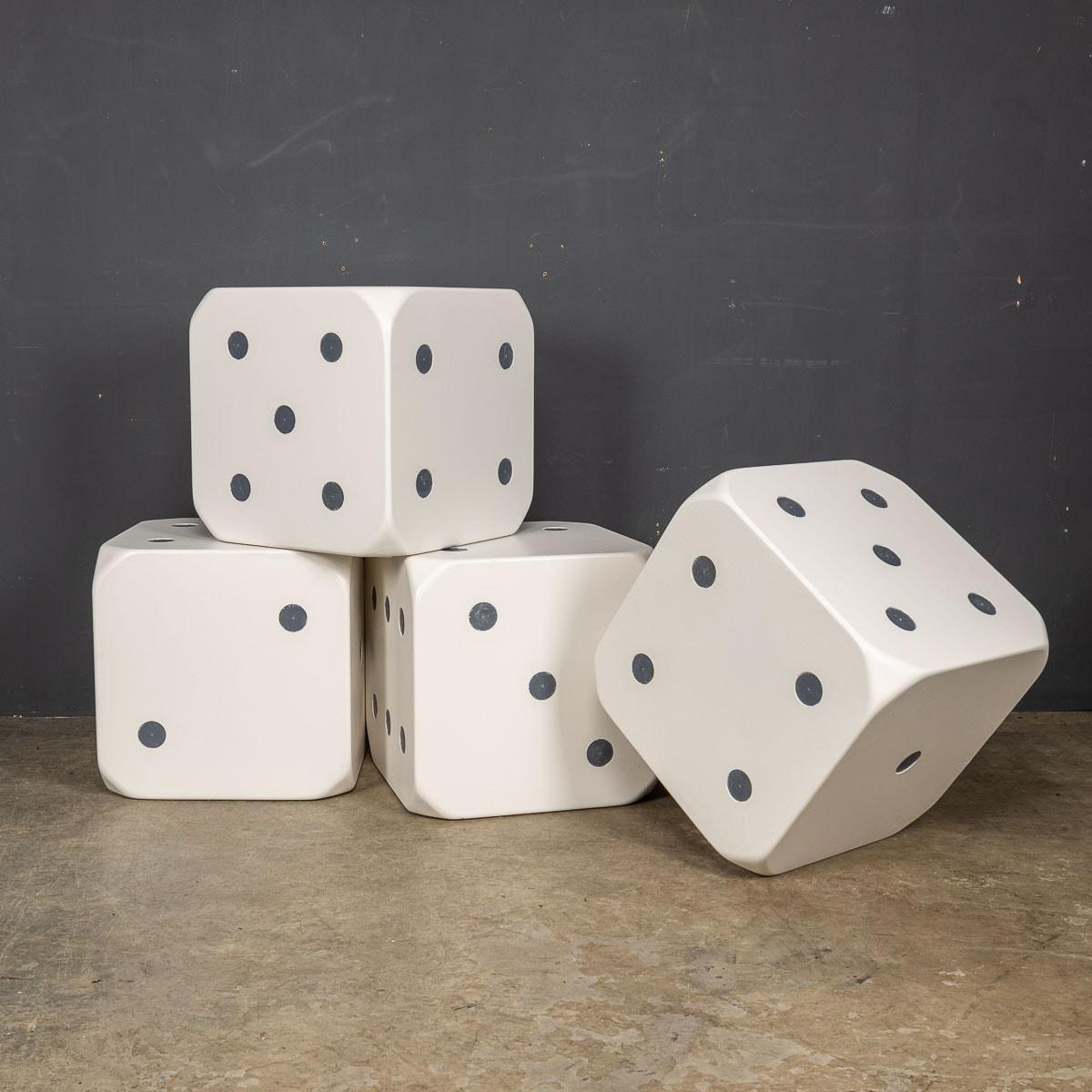 A playful collection of four wooden dice stools or side tables, designed in a delightful white hue adorned with charming grey spots. A wonderful addition to a games room.

CONDITION
In Good Condition - Wear consistent with age

SIZE
Height: