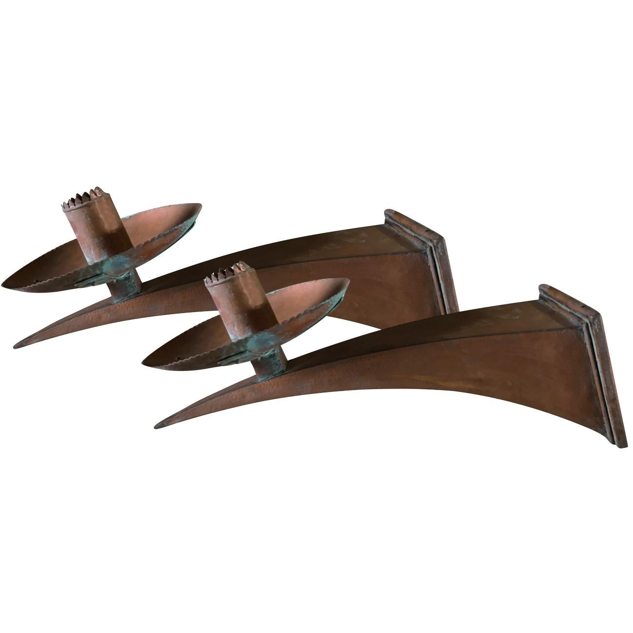 A vintage Art Deco French set of four very impressive wall sconces made of handcrafted copper. The detailed lights are in good condition. Wear consistent with age and use, circa 1930, Pams, France.