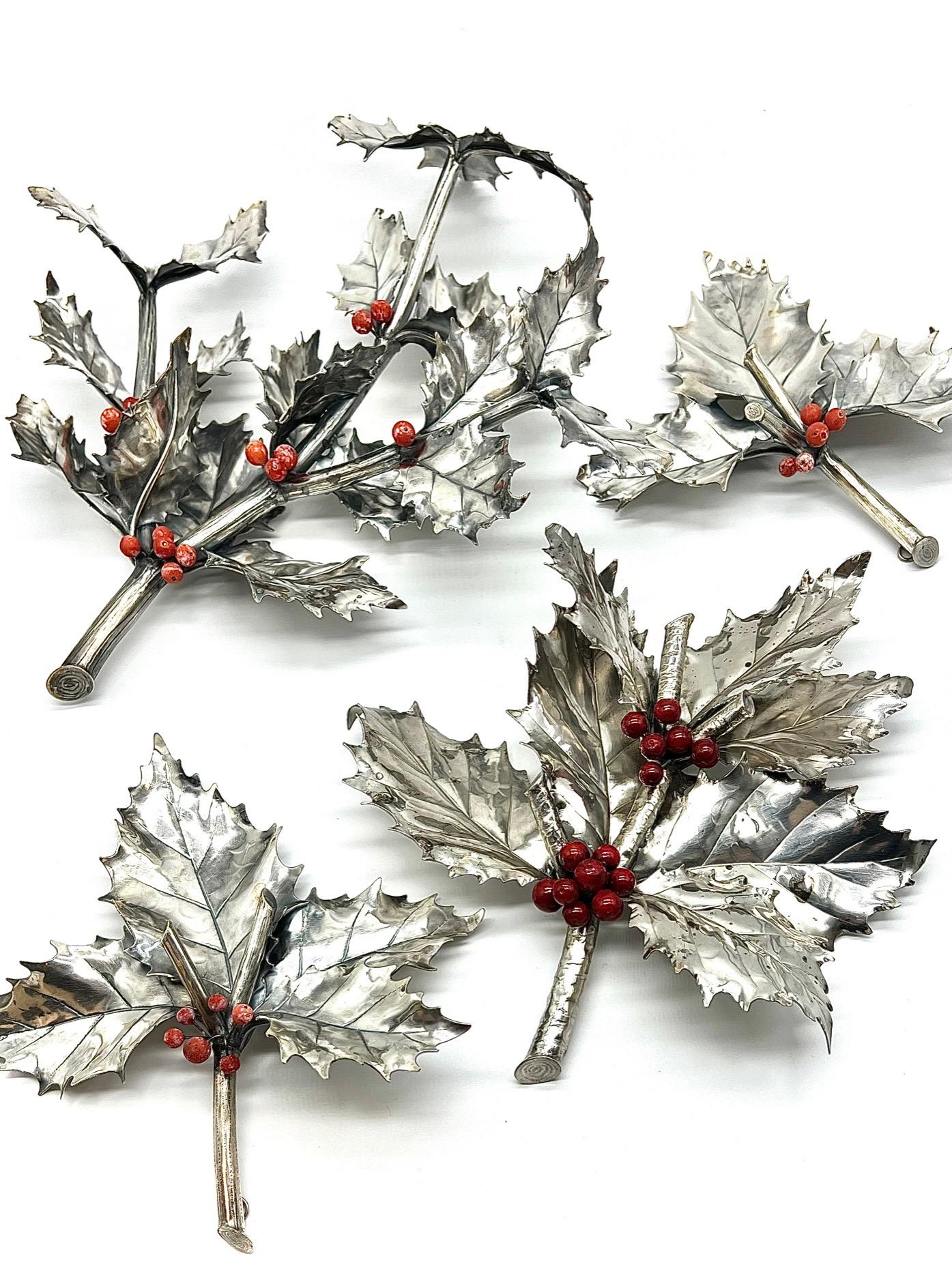 20th Century set of four Italian holly branches by Buccellati, Milan. Each is marked on a leaf Buccellati, 925, and 1169-MI, one Federico Buccellati silver, all with coral berries. The three smaller come with hanging hooks. 

Measures: TWO: 6X6